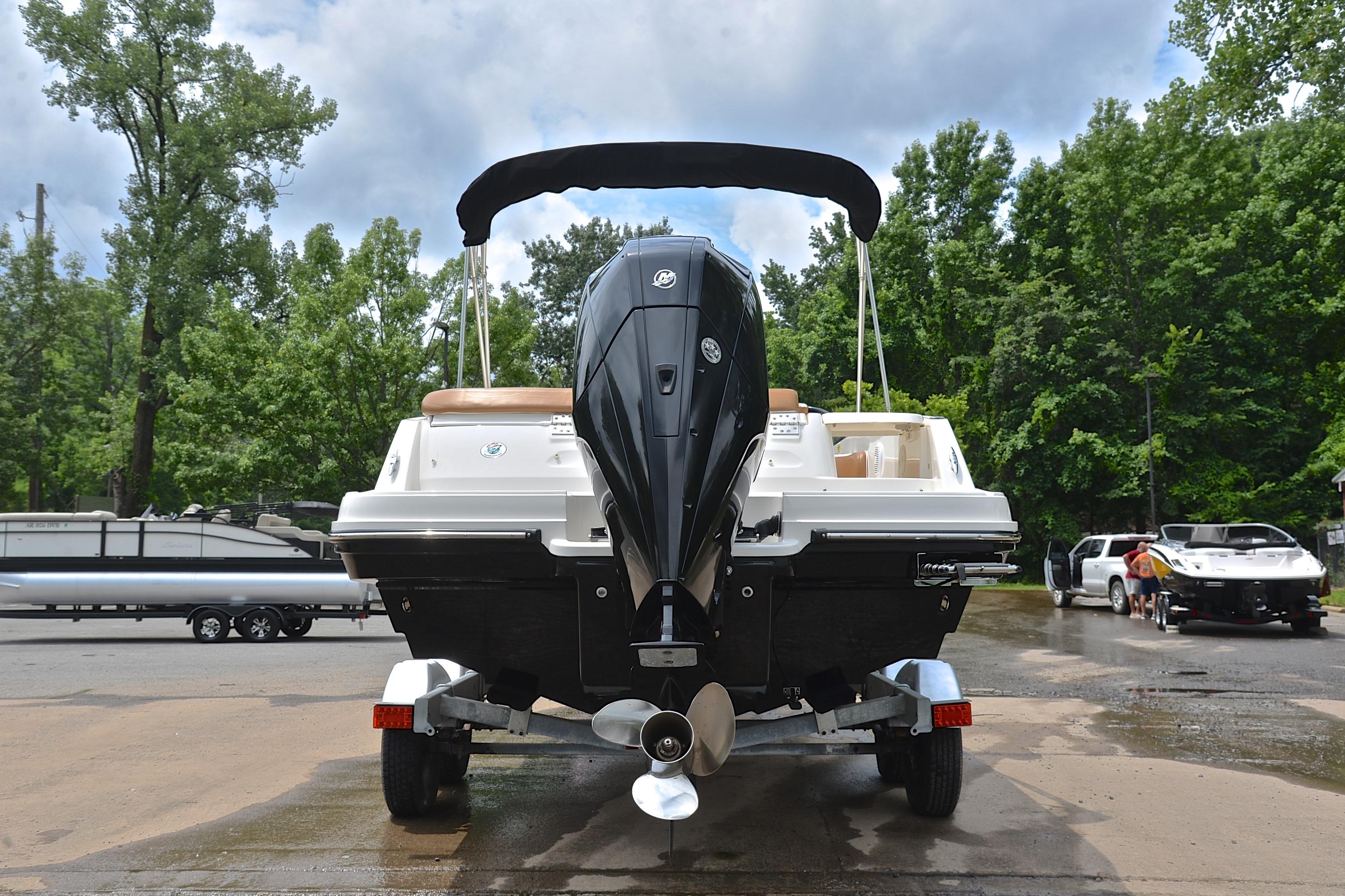 2019 Bayliner VR6 Bowrider OB on trailer, rear view, outdoors with trees.