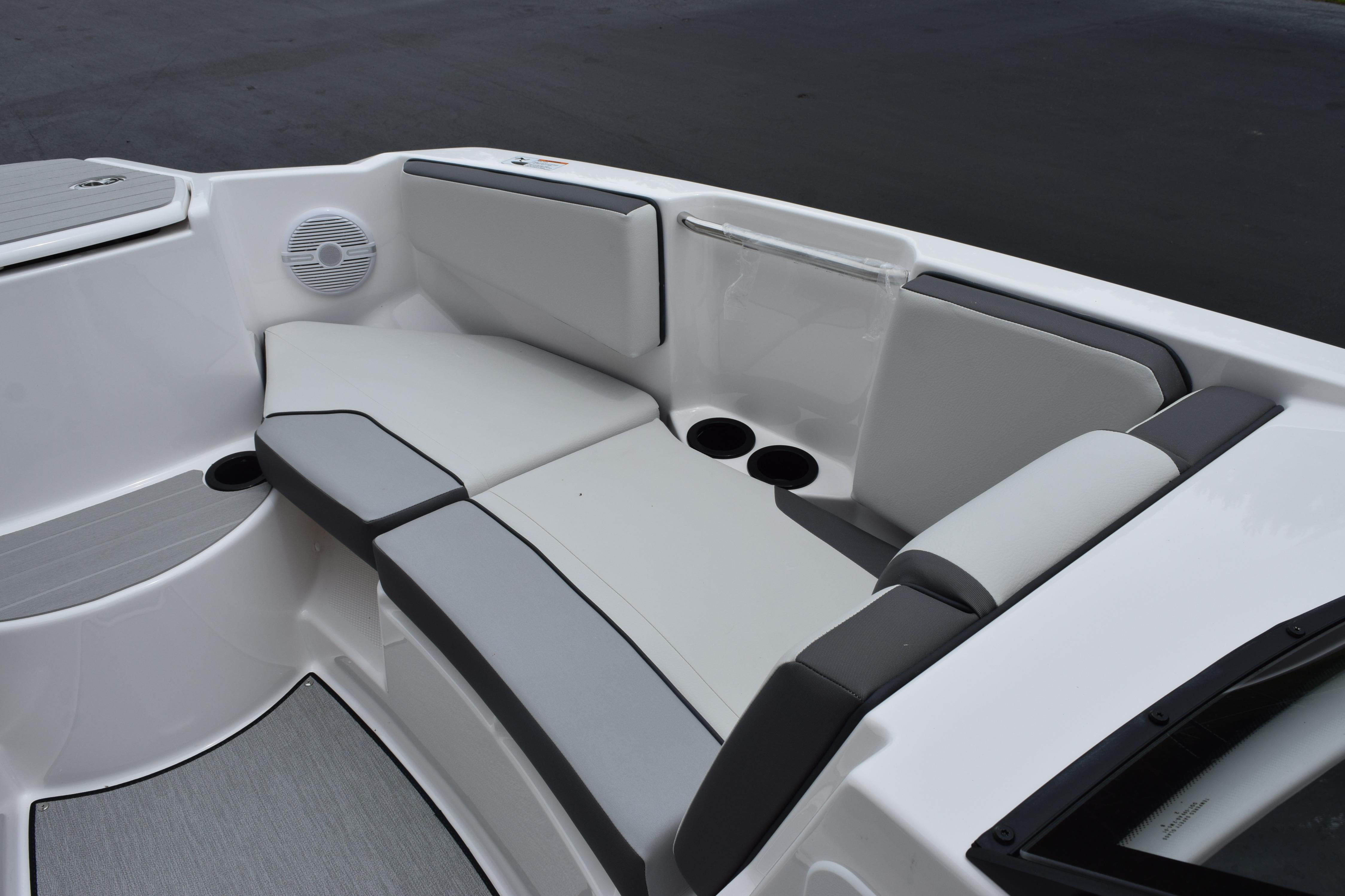 Interior seating of 2026 Yamaha Boats AR220, featuring sleek gray and white upholstery.