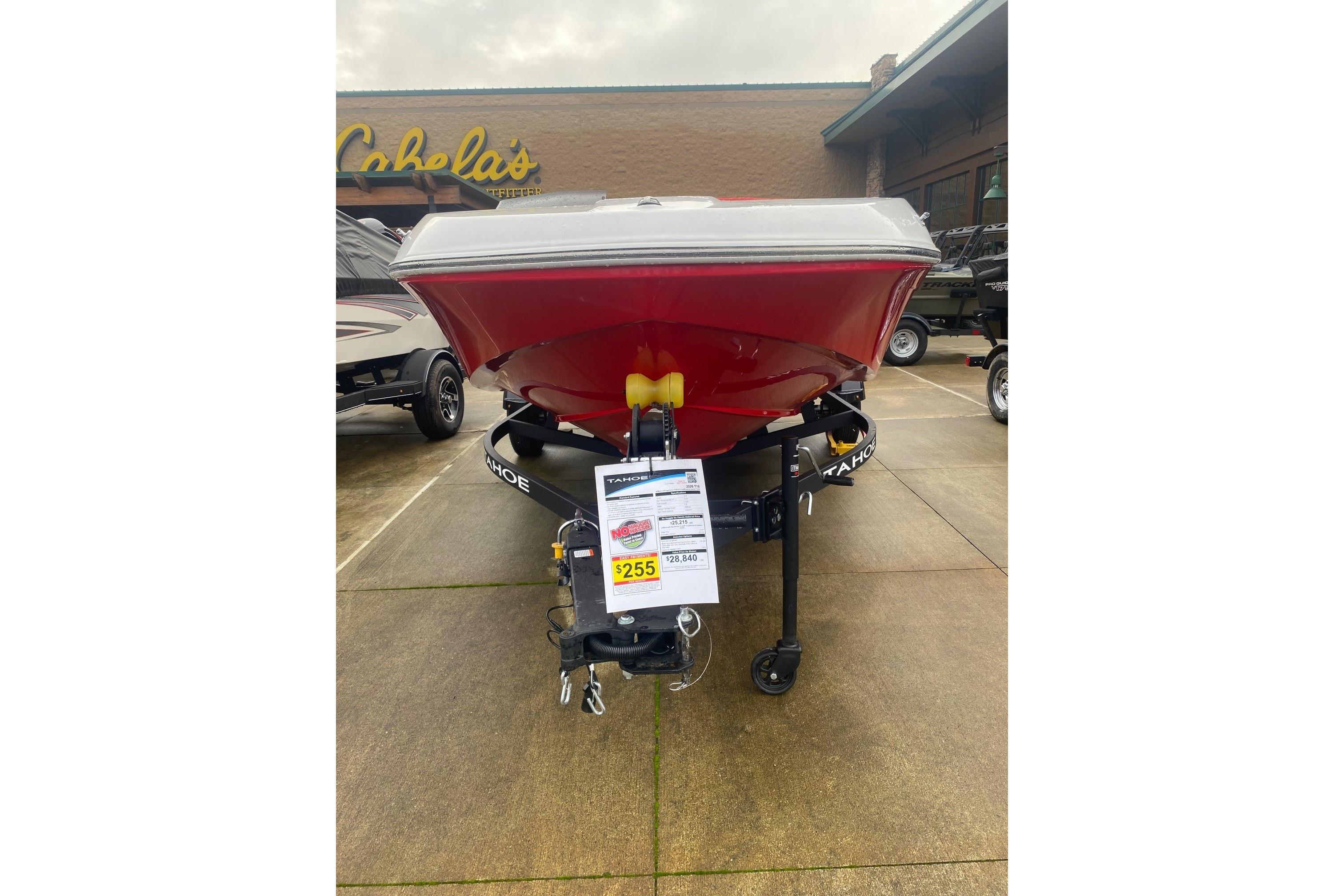2026 Tahoe T16 boat in red on display at Cabela's, front view.