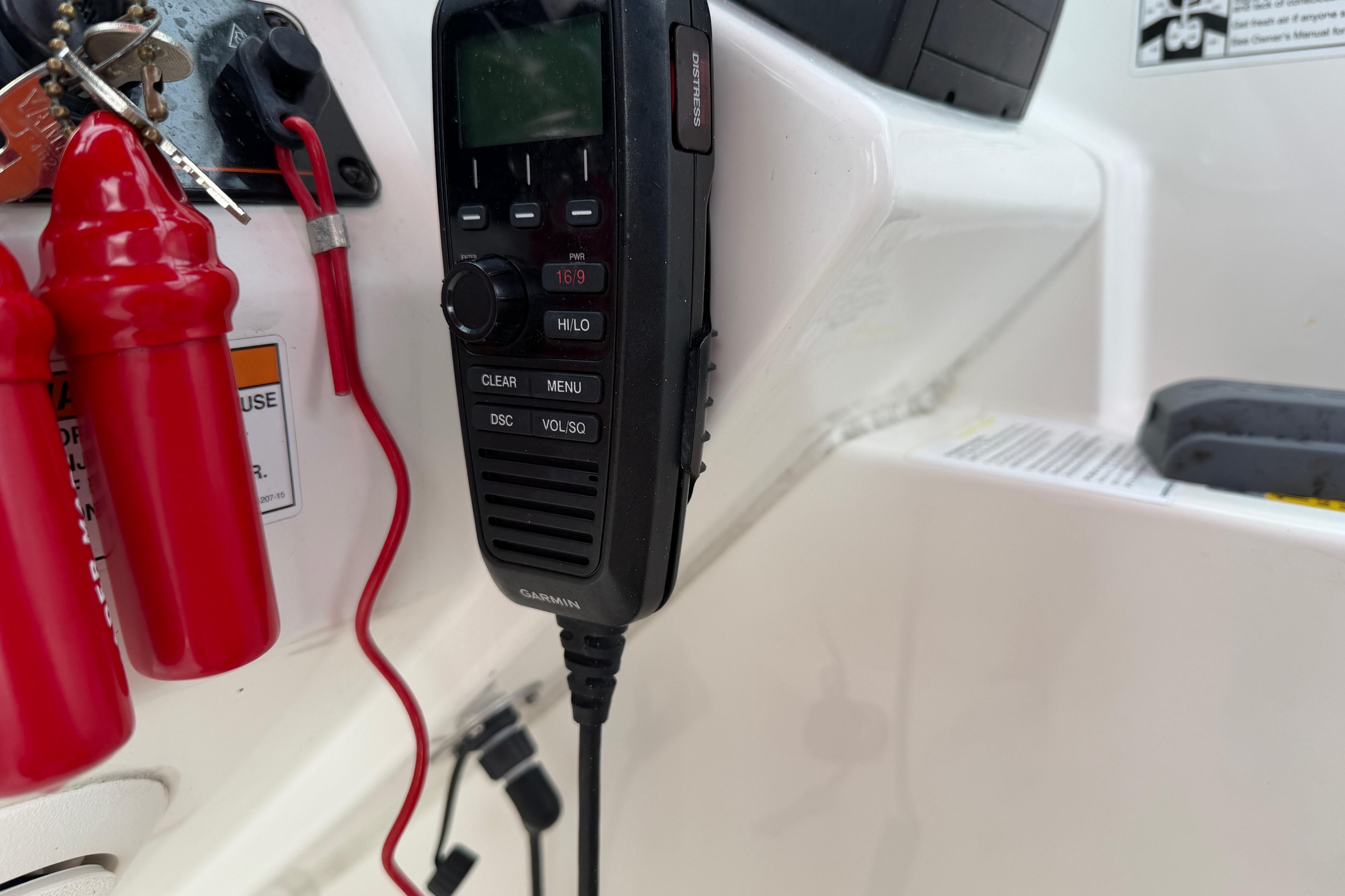 Boat dashboard with Garmin radio and safety equipment on a 2019 World Cat 230 DC.