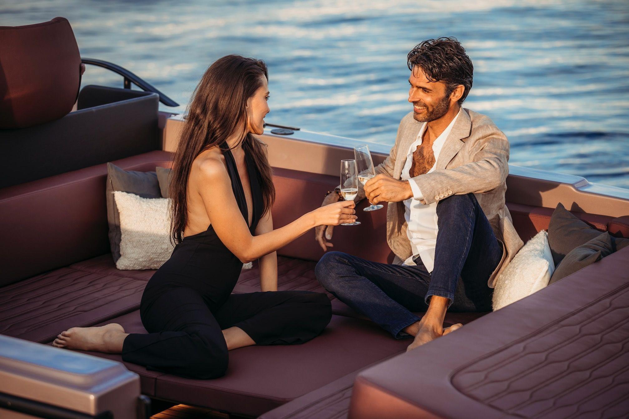 Couple enjoying a toast on a 2026 Cranchi A32 Luxury Tender yacht.