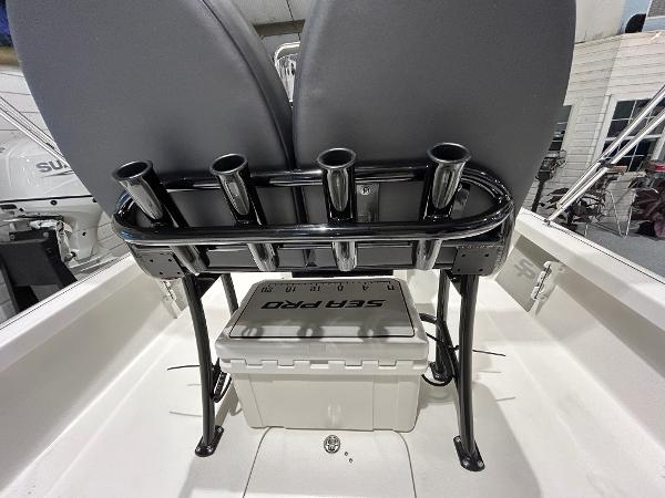 2025 Sea Pro 210 Bay boat interior with rod holders and storage.