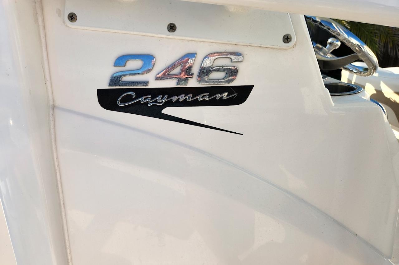2020 Robalo 246 Cayman boat logo on white surface.