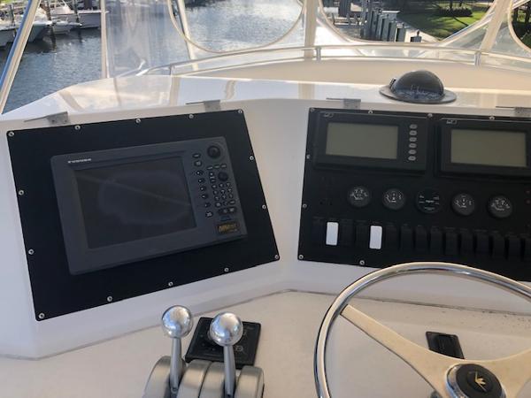 1997 Bertram Convertible boat helm with navigation and control systems.