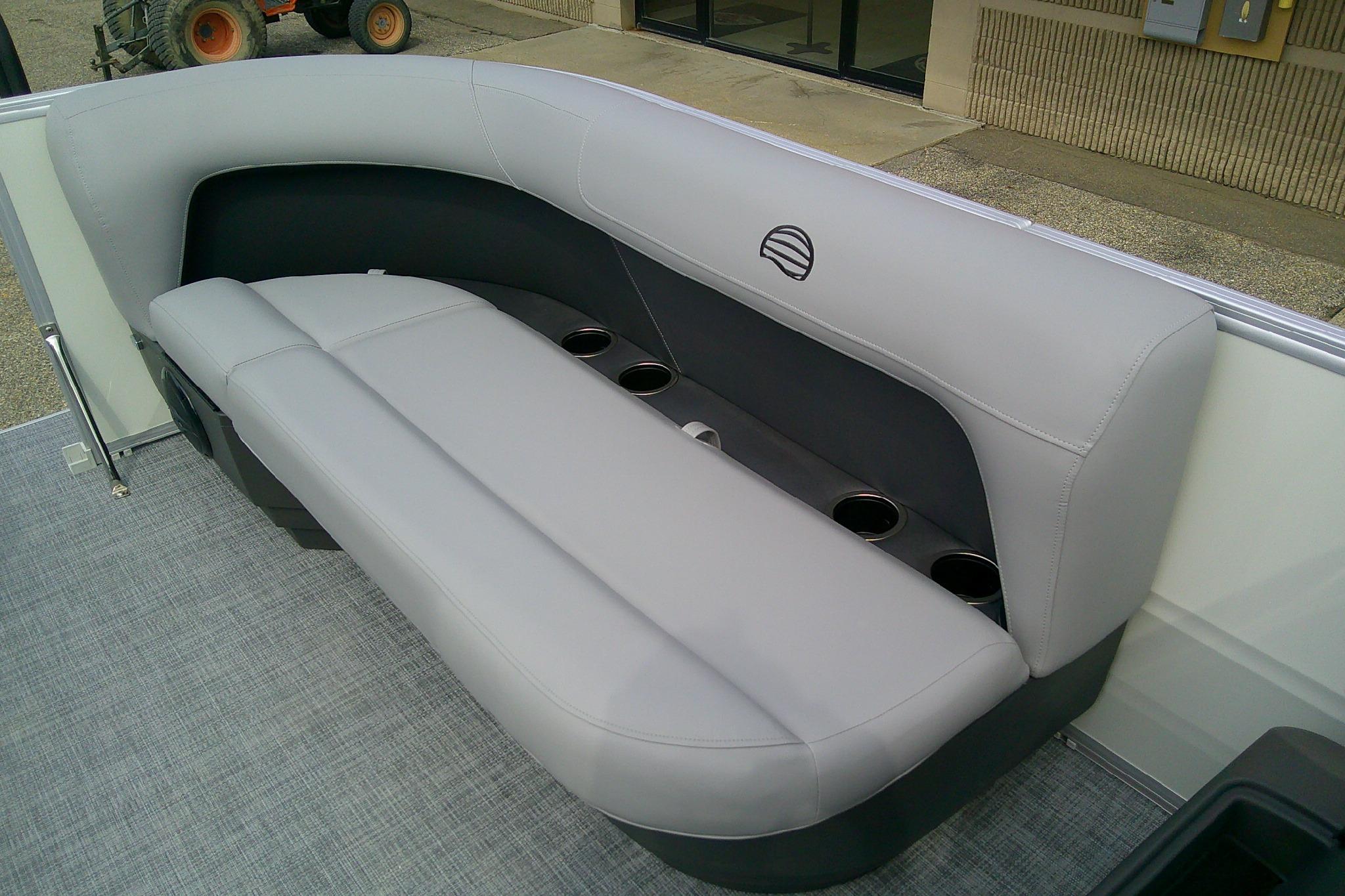 2026 Sun Tracker Party Barge 16 DLX interior seating with cup holders.