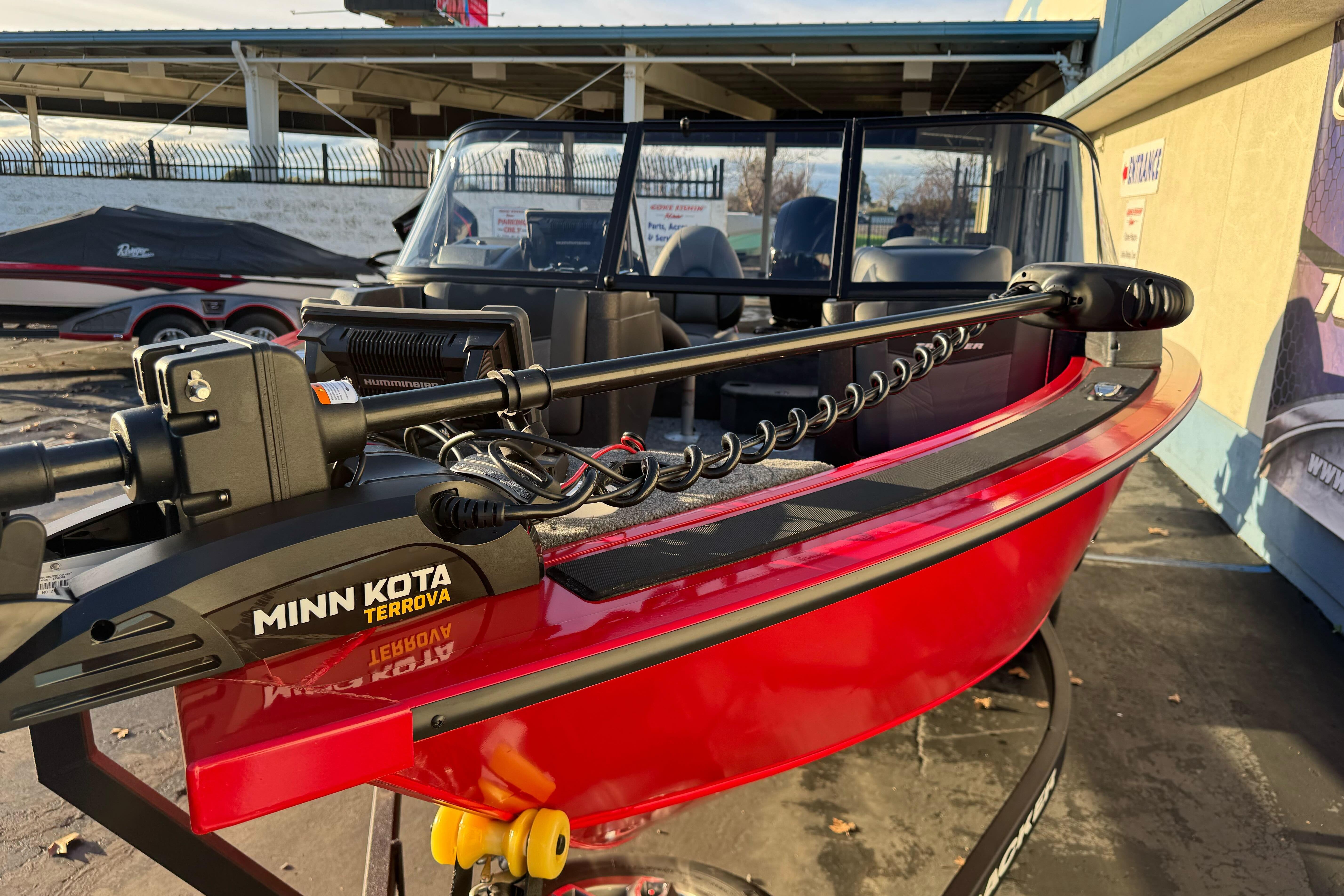 2026 Tracker Targa V-18 WT boat with Minn Kota Terrova motor, red exterior.