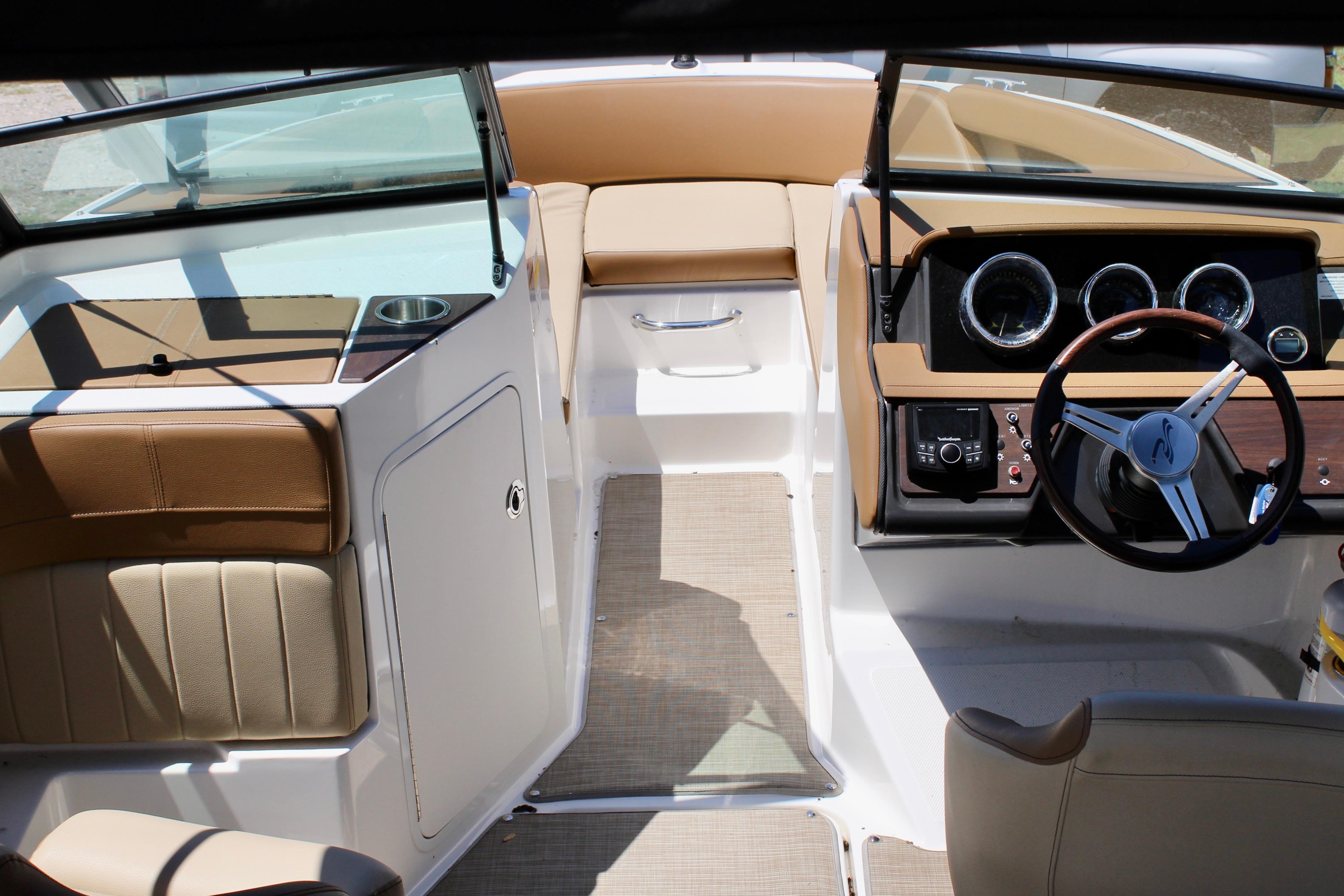 2018 Sea Ray SPX 190 Outboard boat interior with tan seating and modern dashboard.