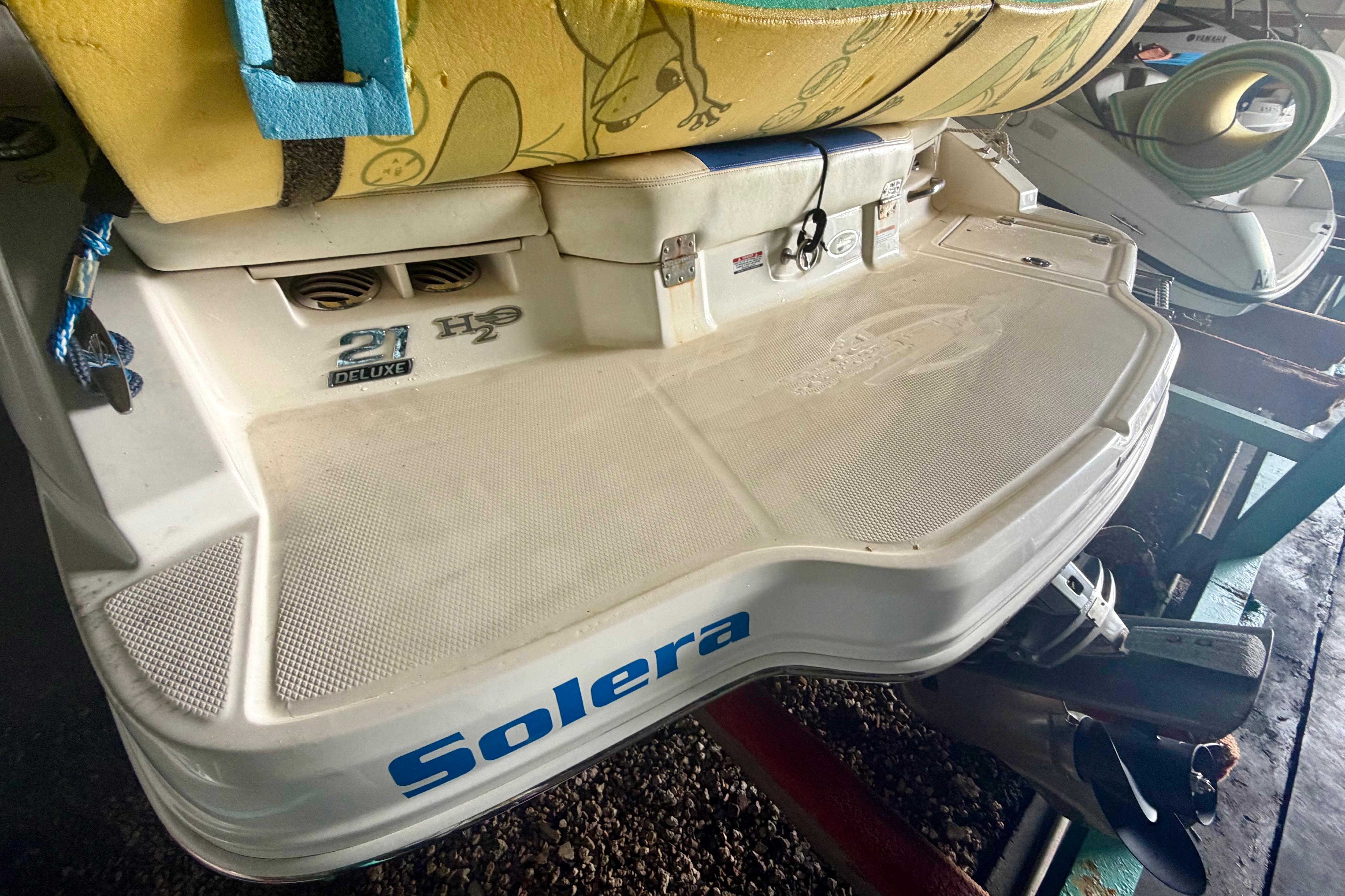 2018 Chaparral 21 H2O Sport boat rear view with "Solera" branding.
