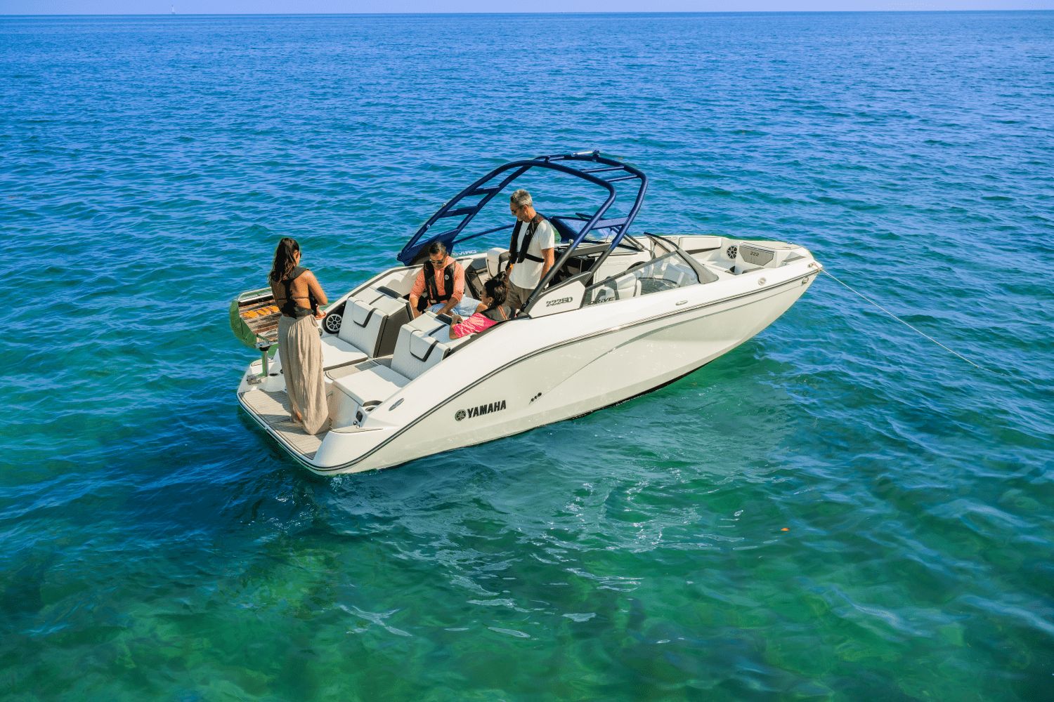 Yamaha 222SD 2026 on calm water with people on board.