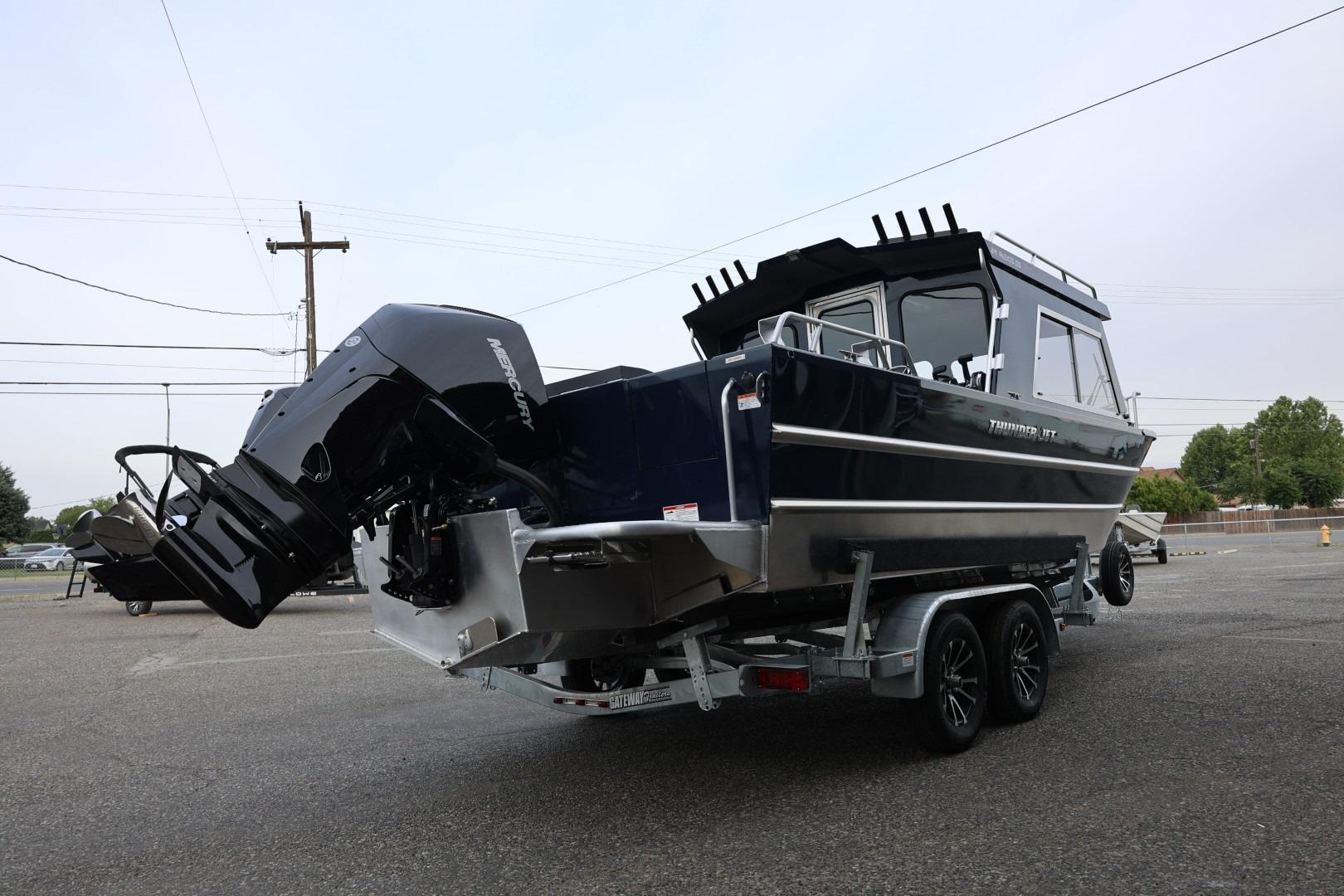 2026 Thunder Jet 24 Alexis Pro boat on trailer, featuring powerful Mercury outboard engine.