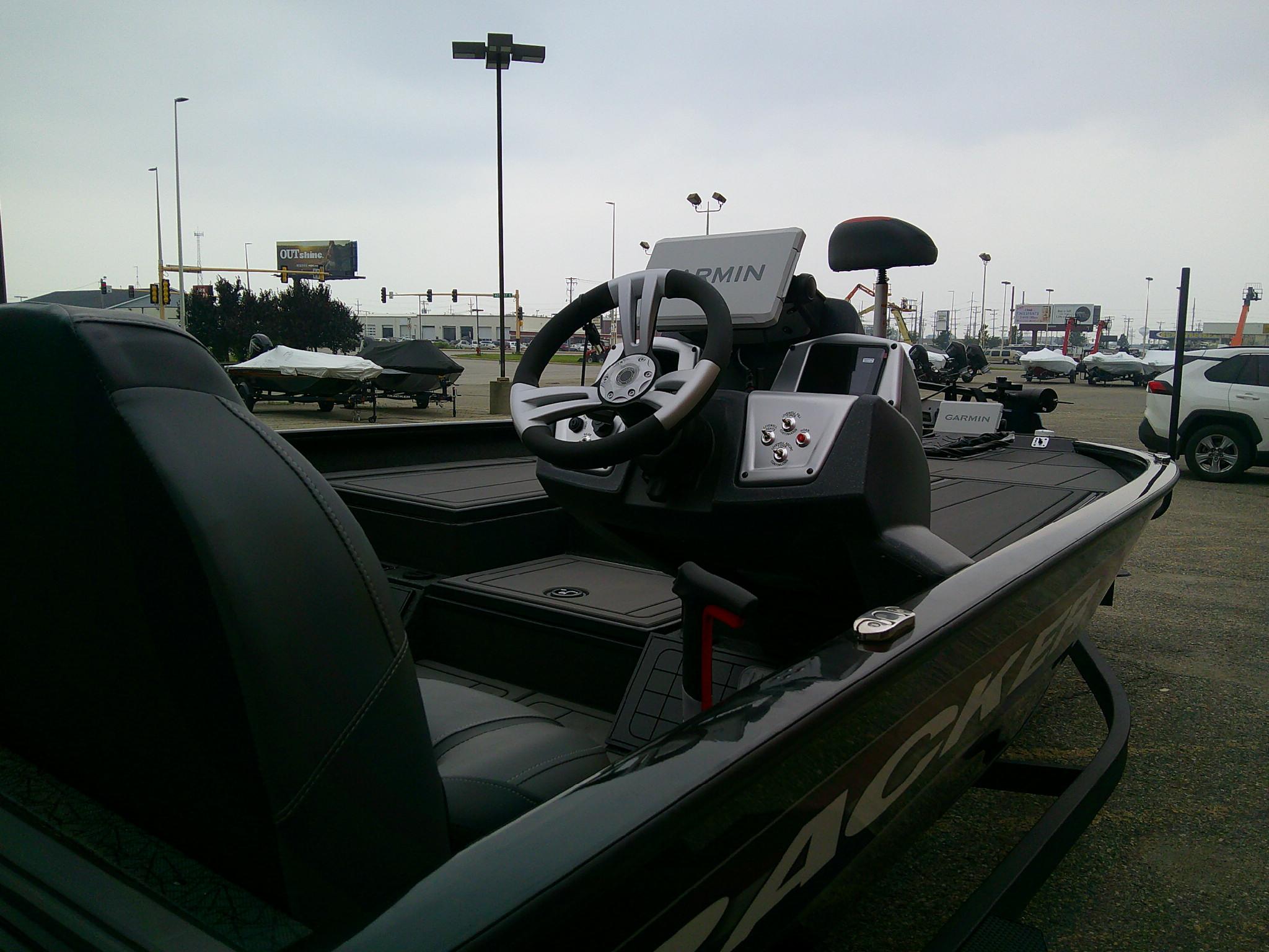 2025 Tracker Savage 215 boat interior with steering wheel and Garmin navigation system.