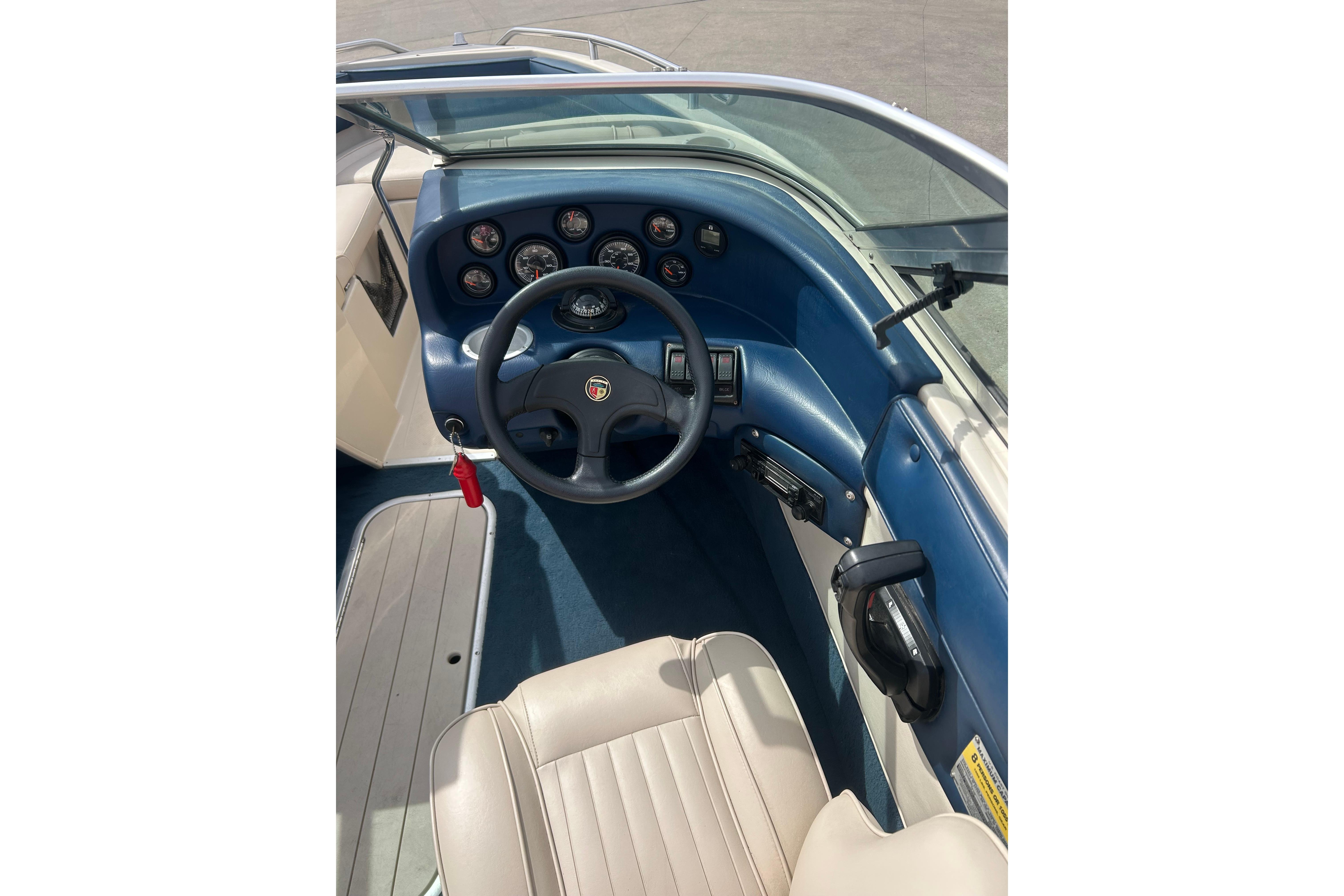 1996 Mariah 180 Shabah boat dashboard with steering wheel and gauges.