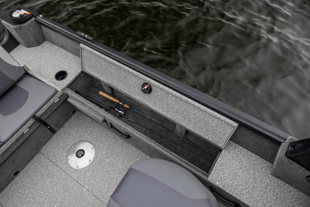 2026 Alumacraft Classic 165 Tiller boat interior with fishing rod storage.