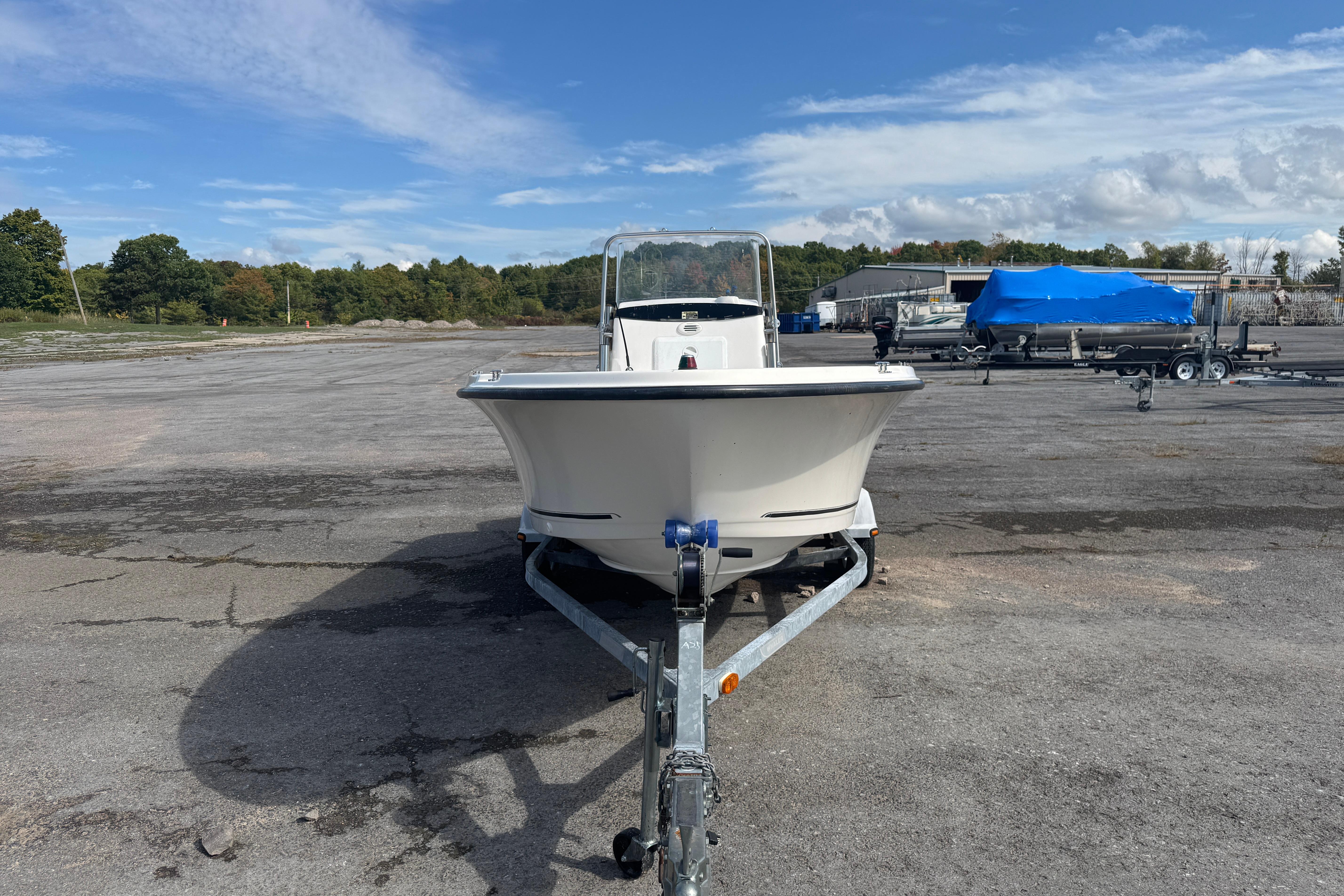 2007 Trophy 1703 Center Console boat on trailer in parking lot.