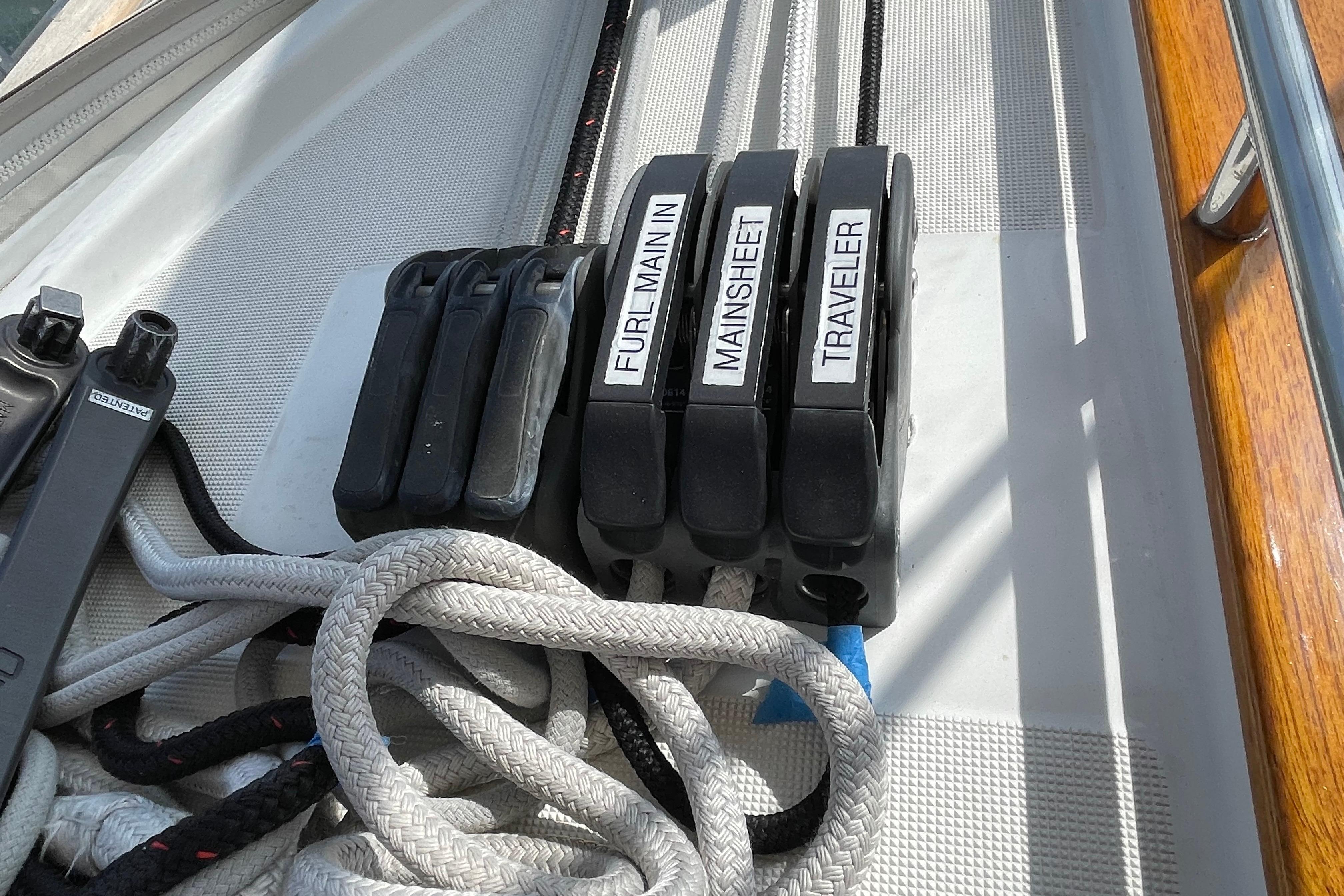 Rope clutches labeled "Furl Main In," "Mainsheet," and "Traveler" on a 2007 Jeanneau Sun Odyssey 39 DS.
