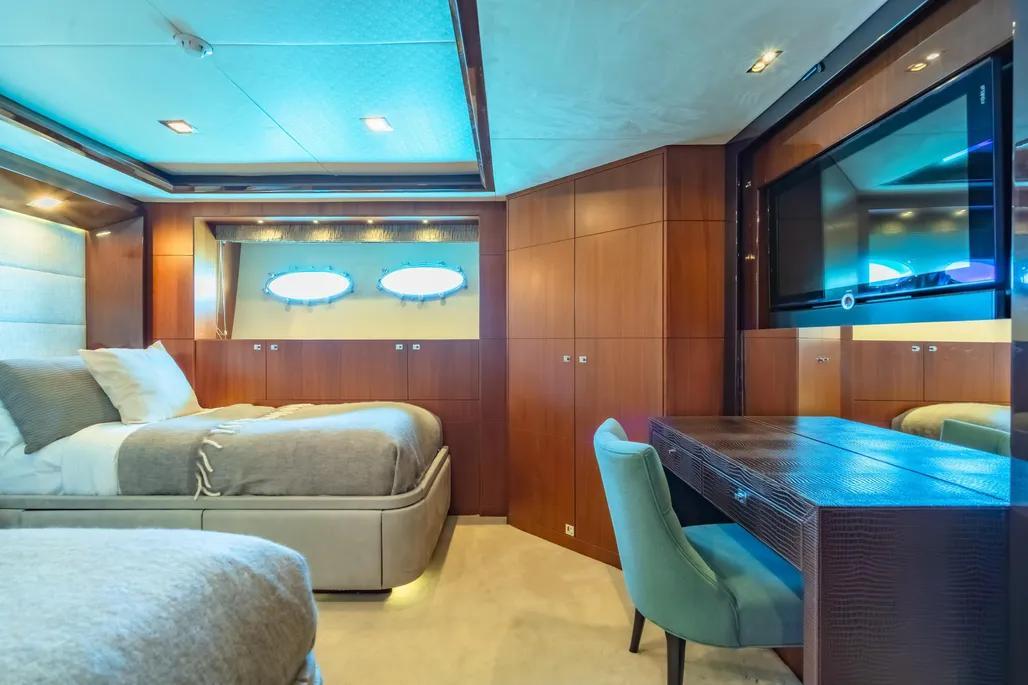 Luxurious bedroom interior on 2013 Princess M Class 32M yacht with modern furnishings.