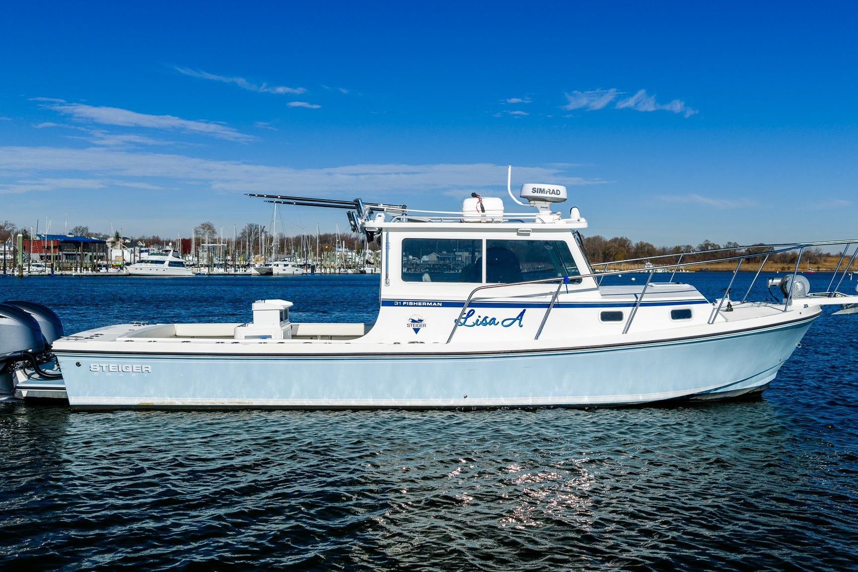 2024 Steiger Craft 31 Fisherman boat on calm water under clear blue sky.
