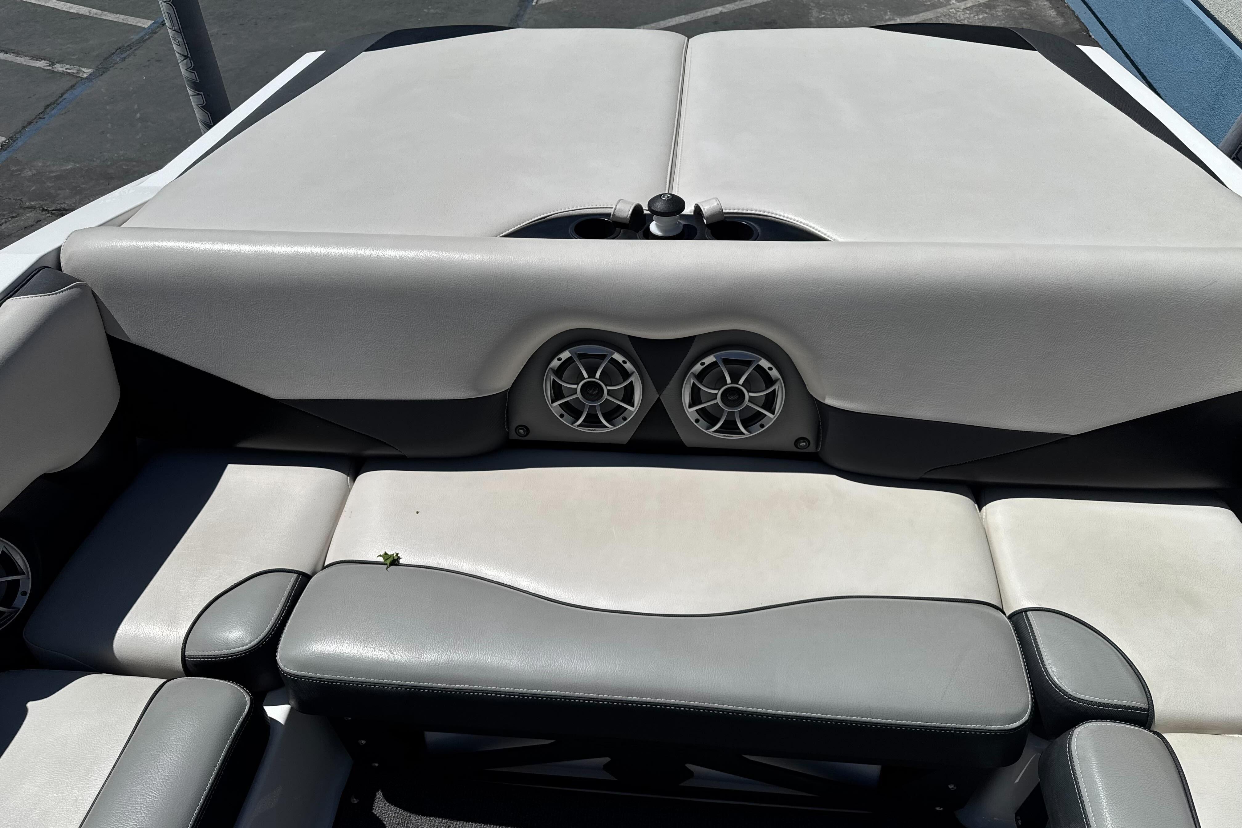 2015 Axis A20 boat interior with gray seating and built-in speakers.