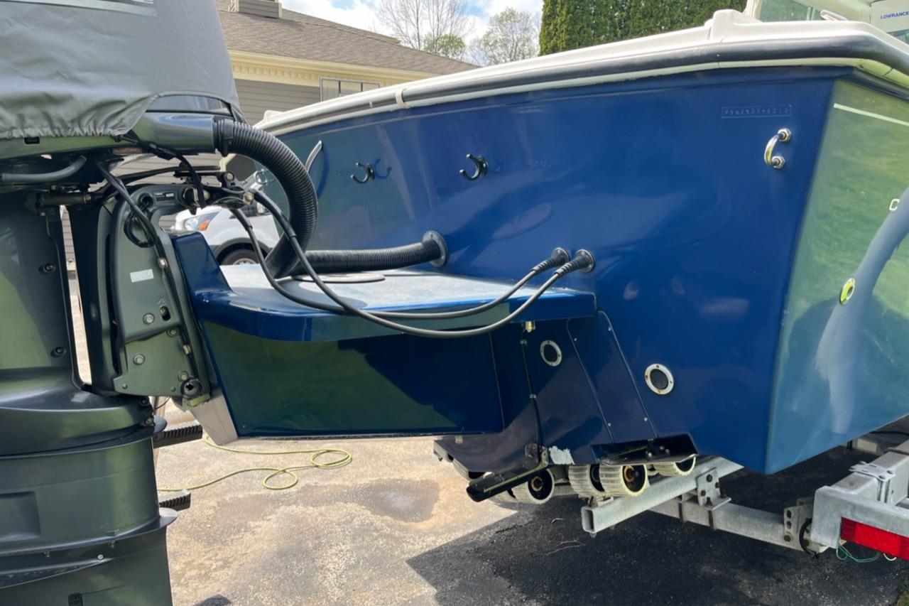 2012 Steiger Craft Miami boat with outboard motor on trailer, blue hull.