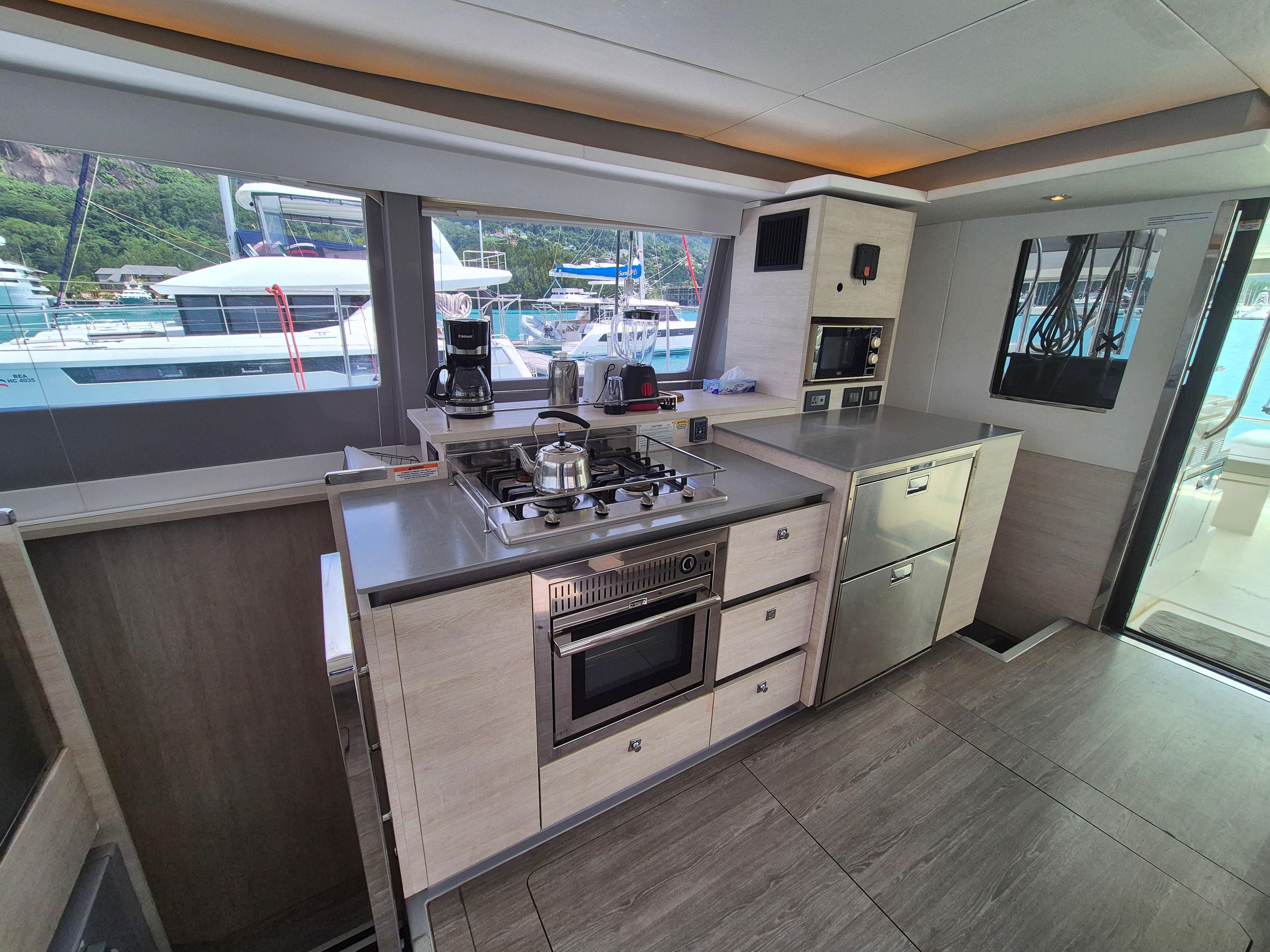 Modern kitchen interior on a 2020 Leopard 50 yacht, featuring sleek appliances and ample counter space.