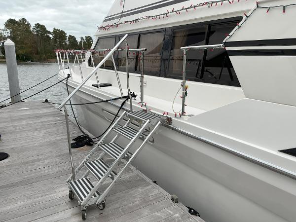 Novatec Islander 55 yacht docked with metal boarding stairs, 2000 model.