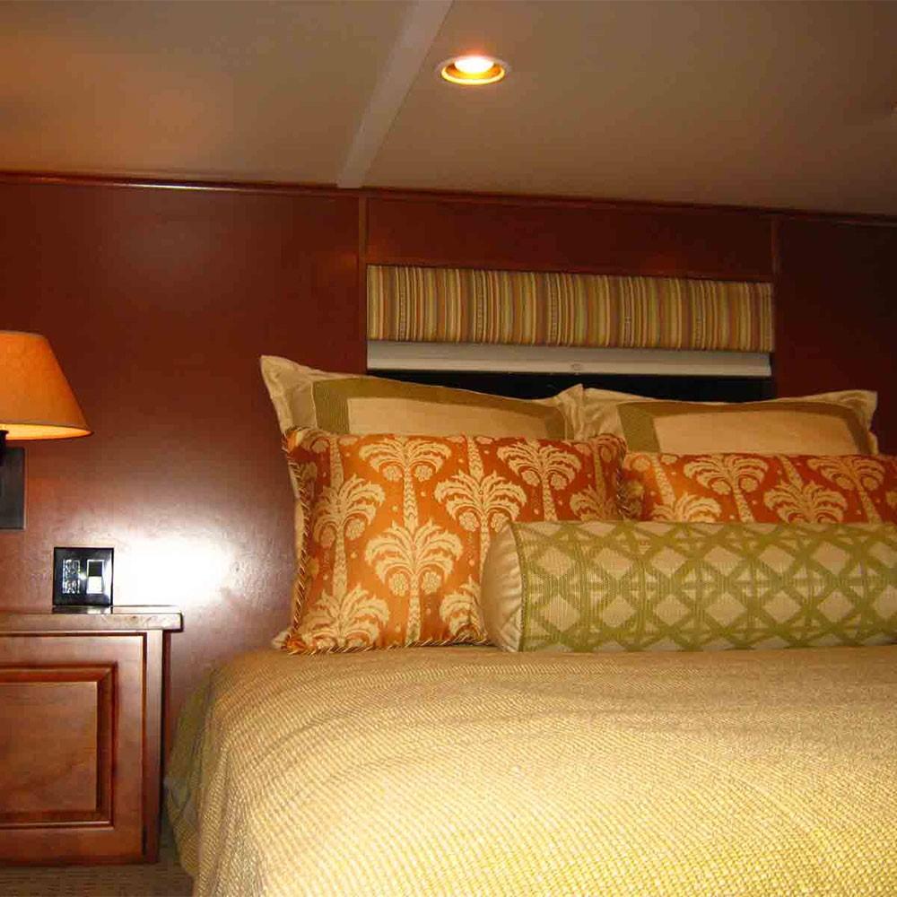 Luxurious bedroom interior of 2011 Bravada Dream Weaver Trip 15 houseboat.