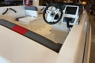 2026 Tahoe T18 boat interior with steering wheel and seating, showcasing modern design.