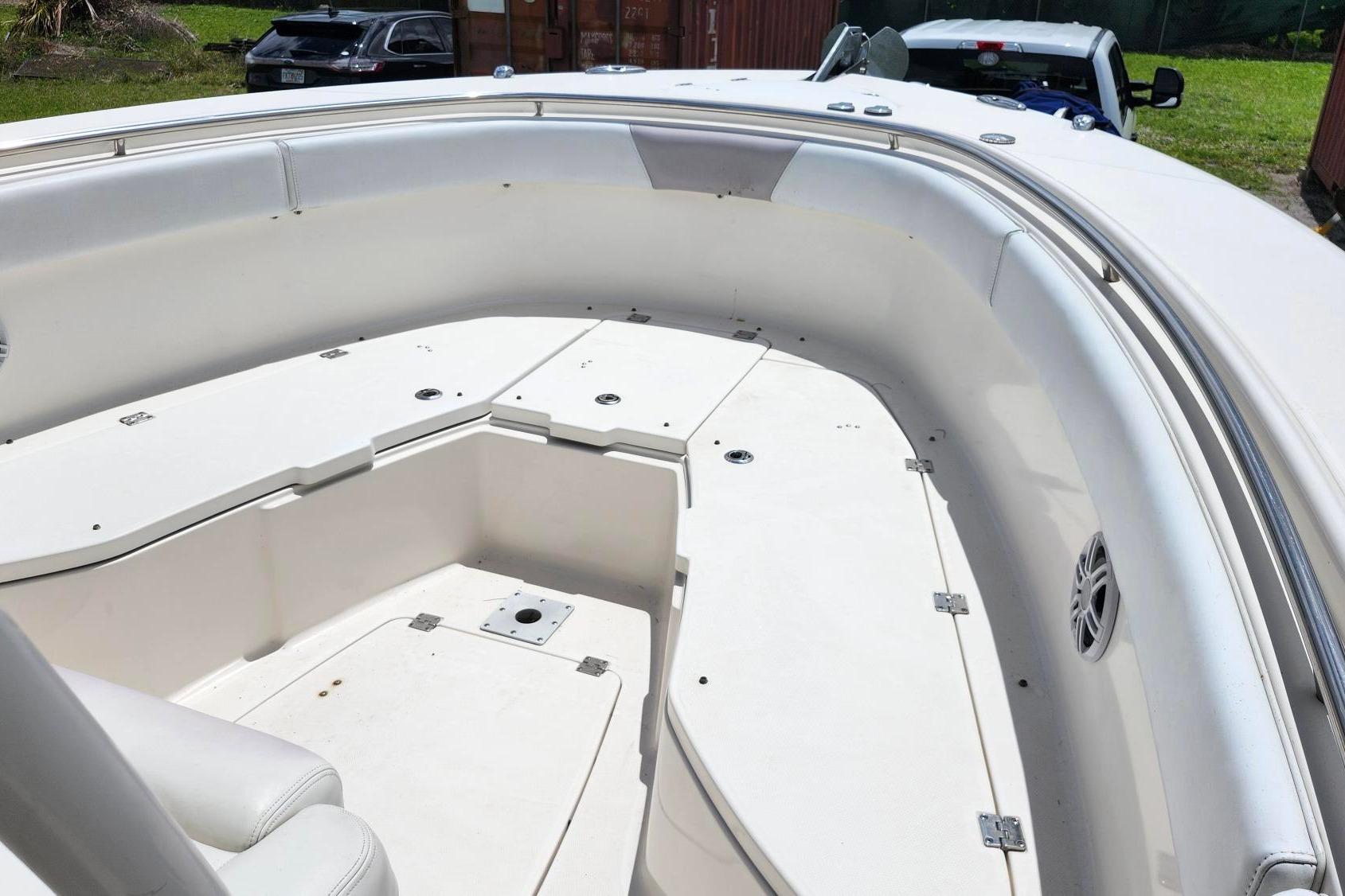 2015 Robalo R300 Center Console boat interior with seating and storage compartments.