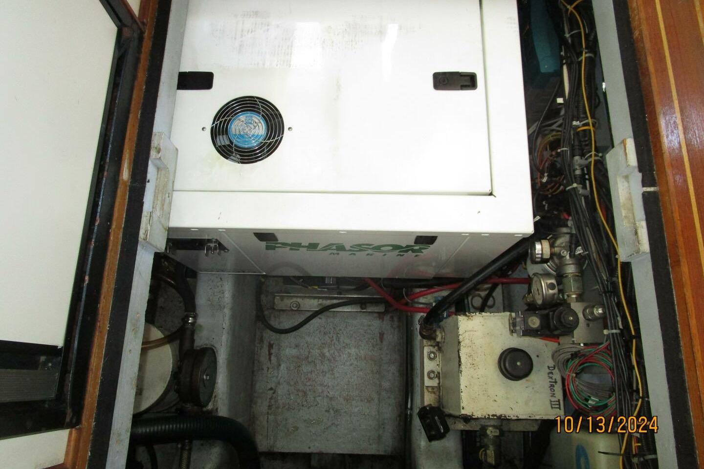 Engine room of a 1997 Rosborough Trawler with Phasor generator and wiring.