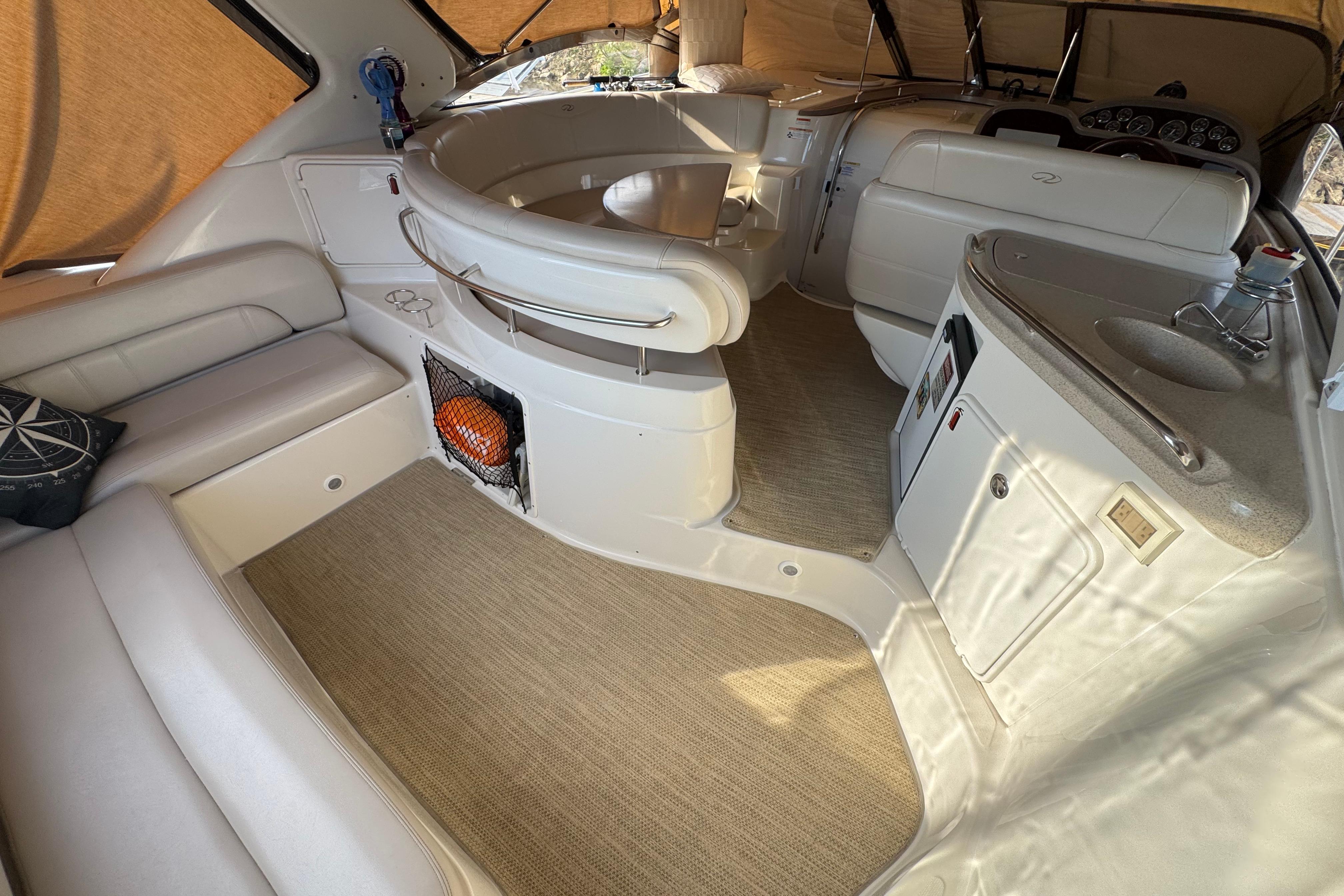 Interior of 2007 Regal Commodore 3860 yacht with seating and kitchenette.