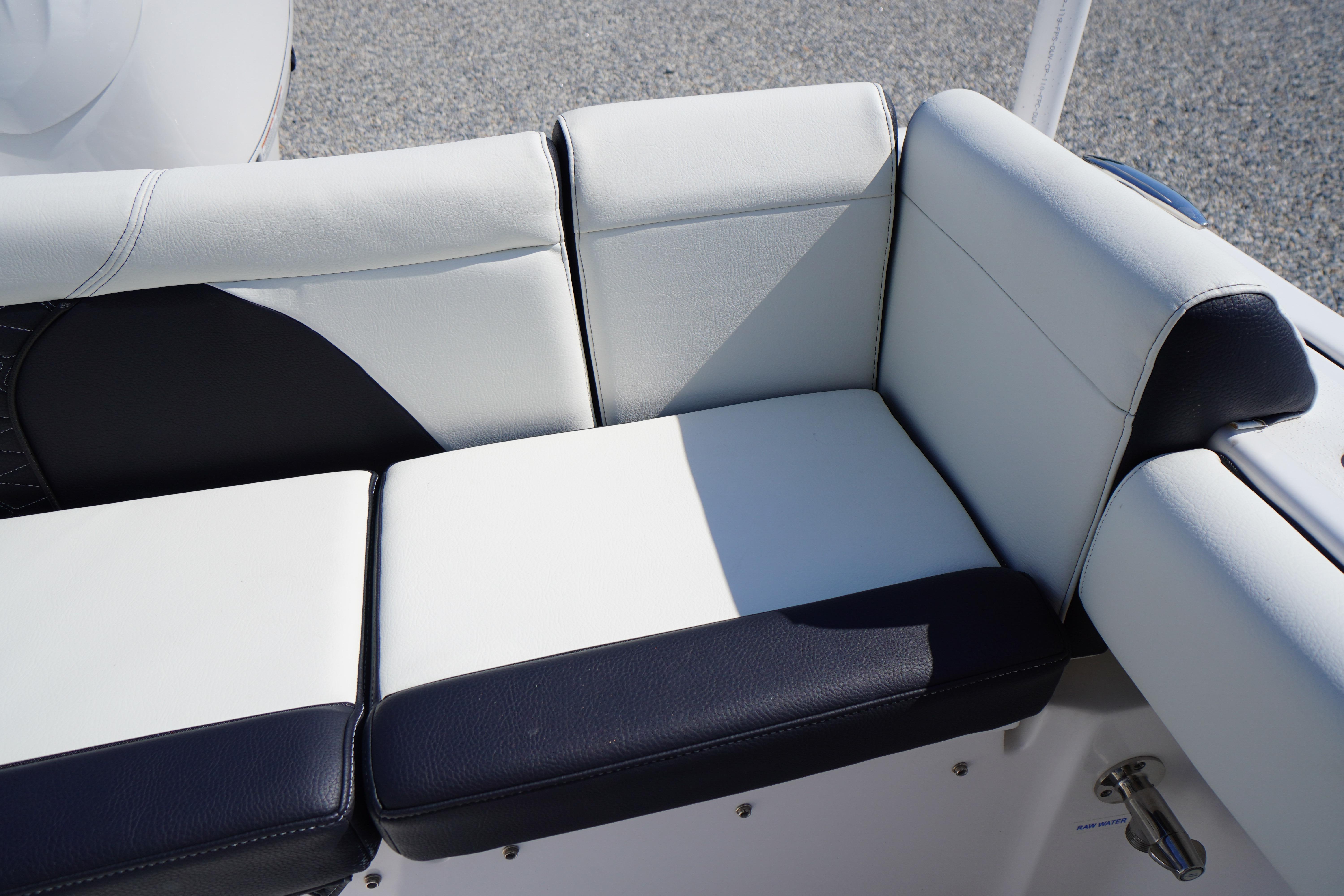 2025 Tidewater 232 SS boat seating with white and black upholstery.