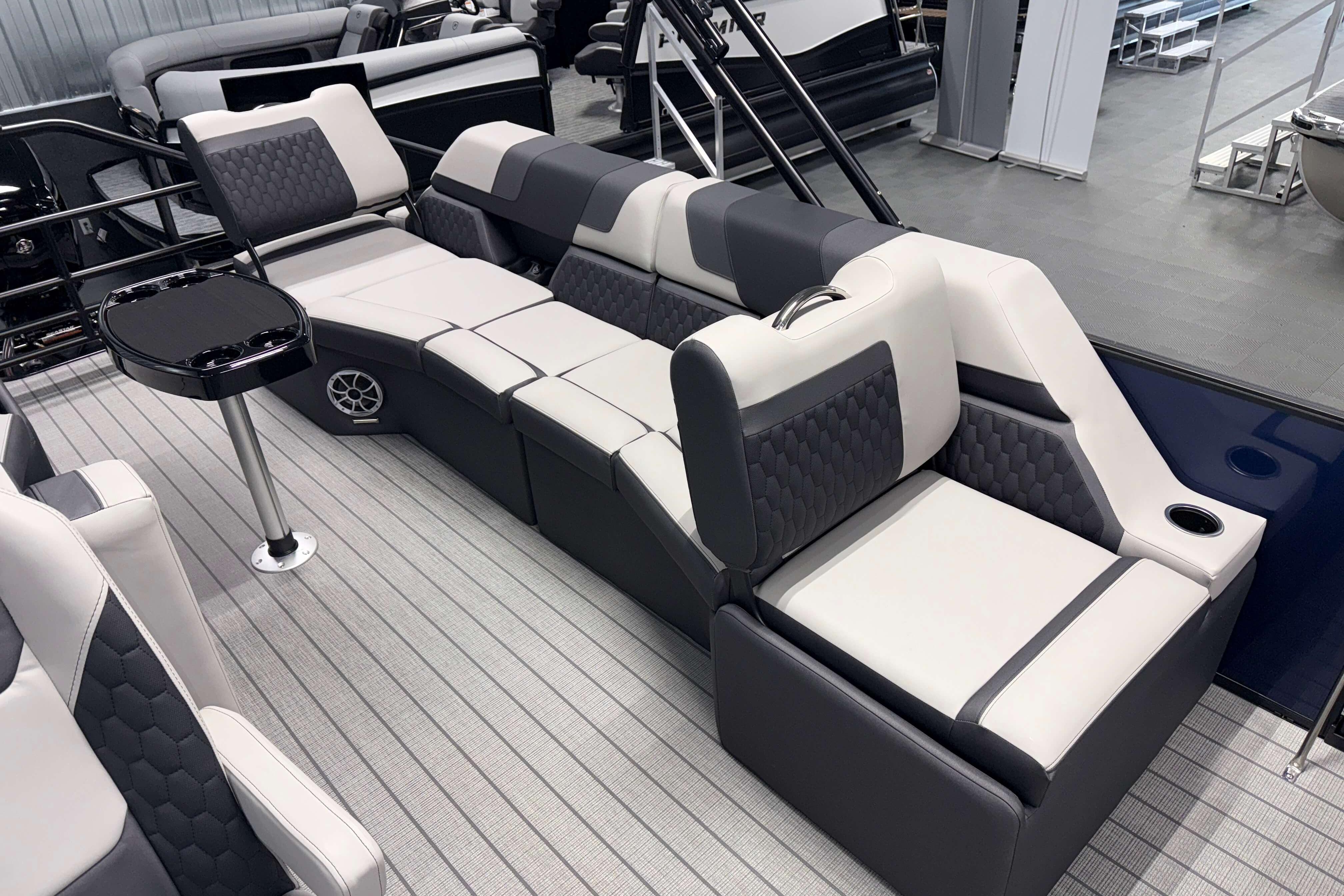 Luxurious seating on 2026 Sylvan L3 SLZ pontoon boat with modern design and amenities.