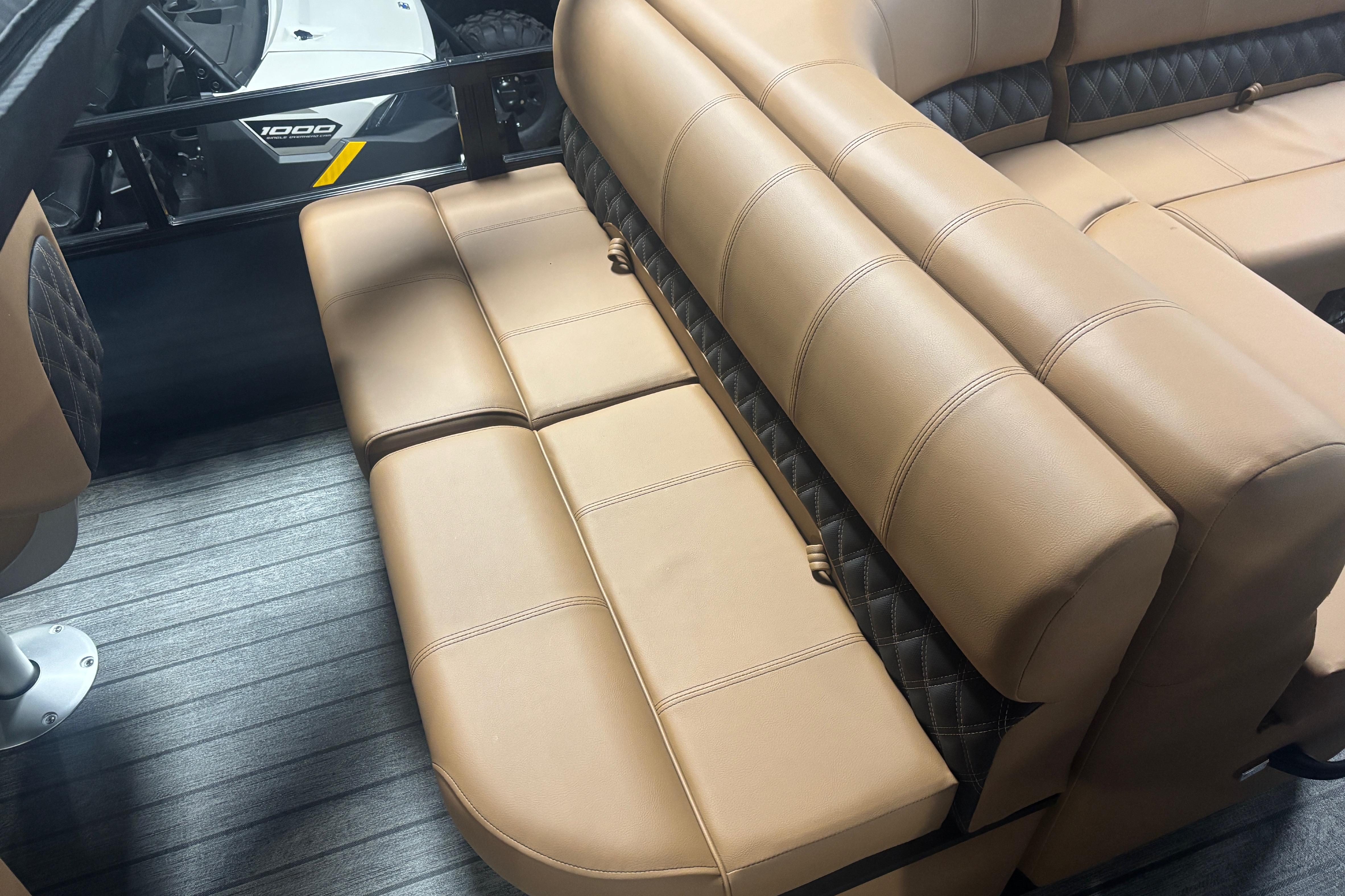 2026 Ranger 223F boat interior with tan leather seating and quilted accents.