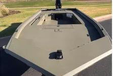 2026 Tracker Grizzly 1654 T Sportsman boat, featuring a spacious deck design.