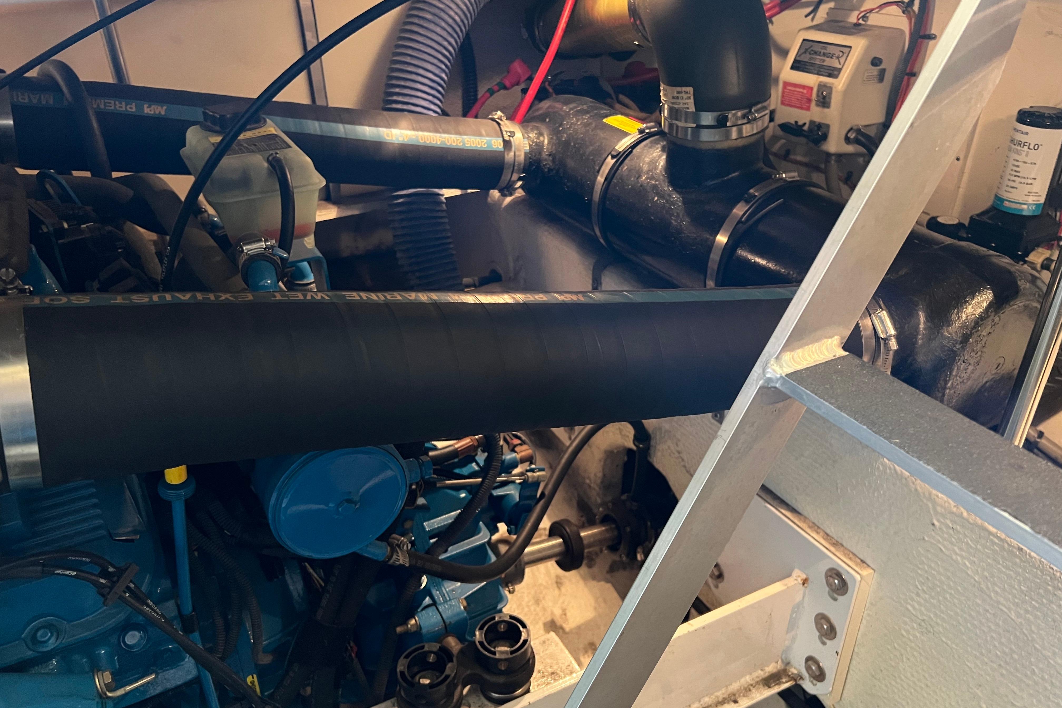 Engine compartment of a 2006 Silverton 38 Sport Bridge, showcasing mechanical components.