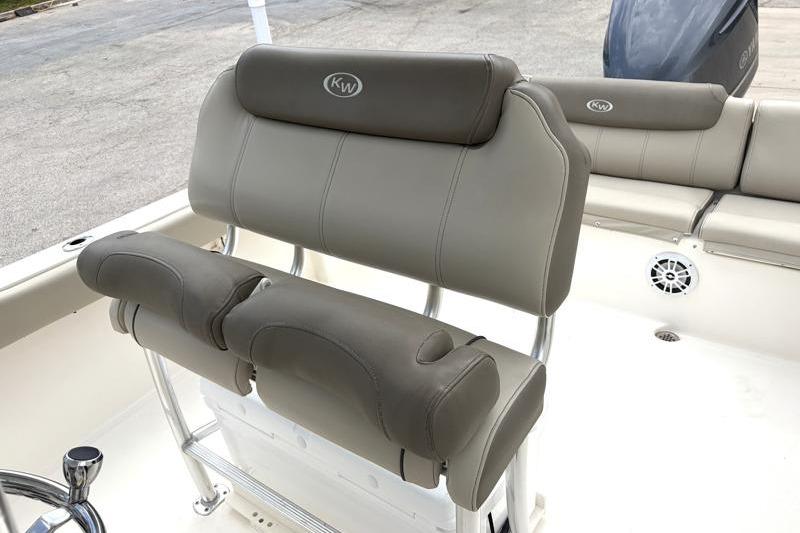2024 Key West 239 FS boat seating with beige upholstery and KW logo.