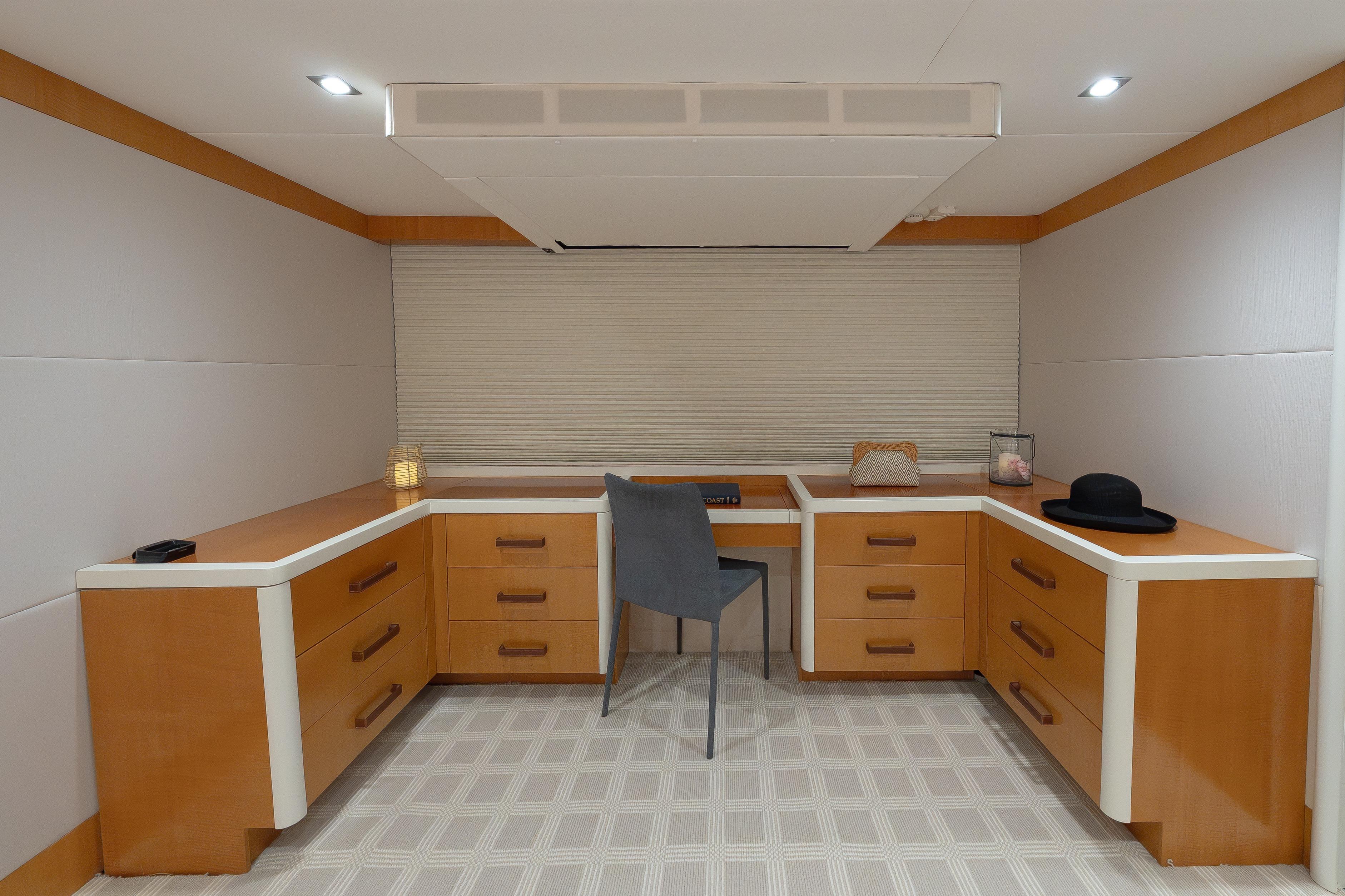 Luxurious 2012 Lazzara Breeze yacht interior with modern wooden cabinetry and elegant decor.
