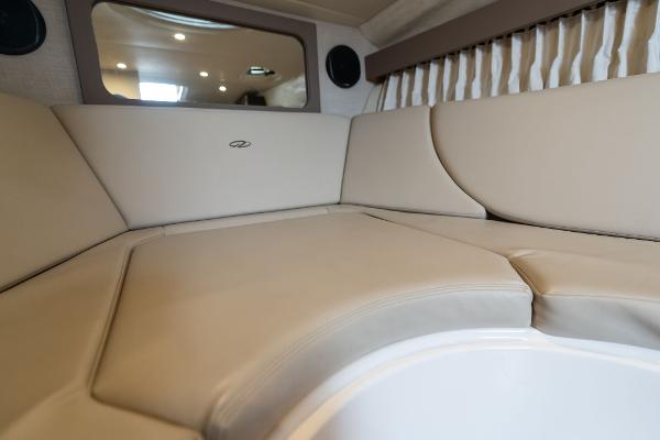 Interior of 2016 Regal 28 Express boat with beige seating and modern design.