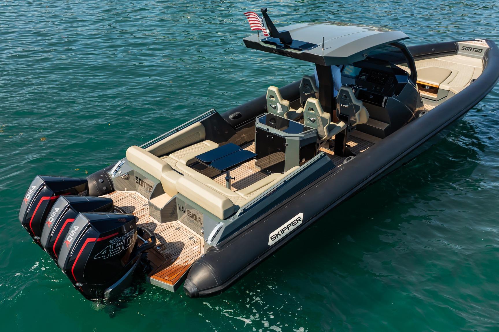 2023 Skipper-BSK 38NC boat with triple outboard engines on clear water.