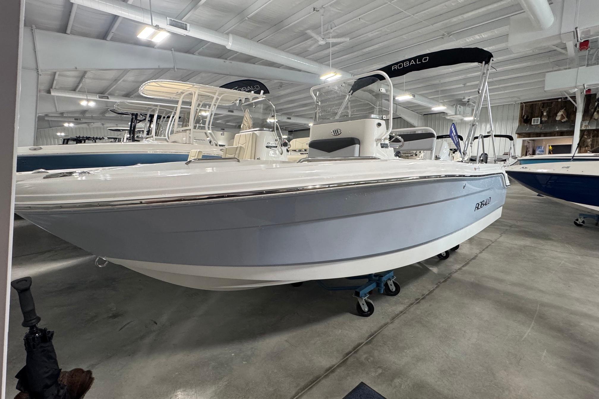 2026 Robalo R160 Center Console boat displayed in a showroom.