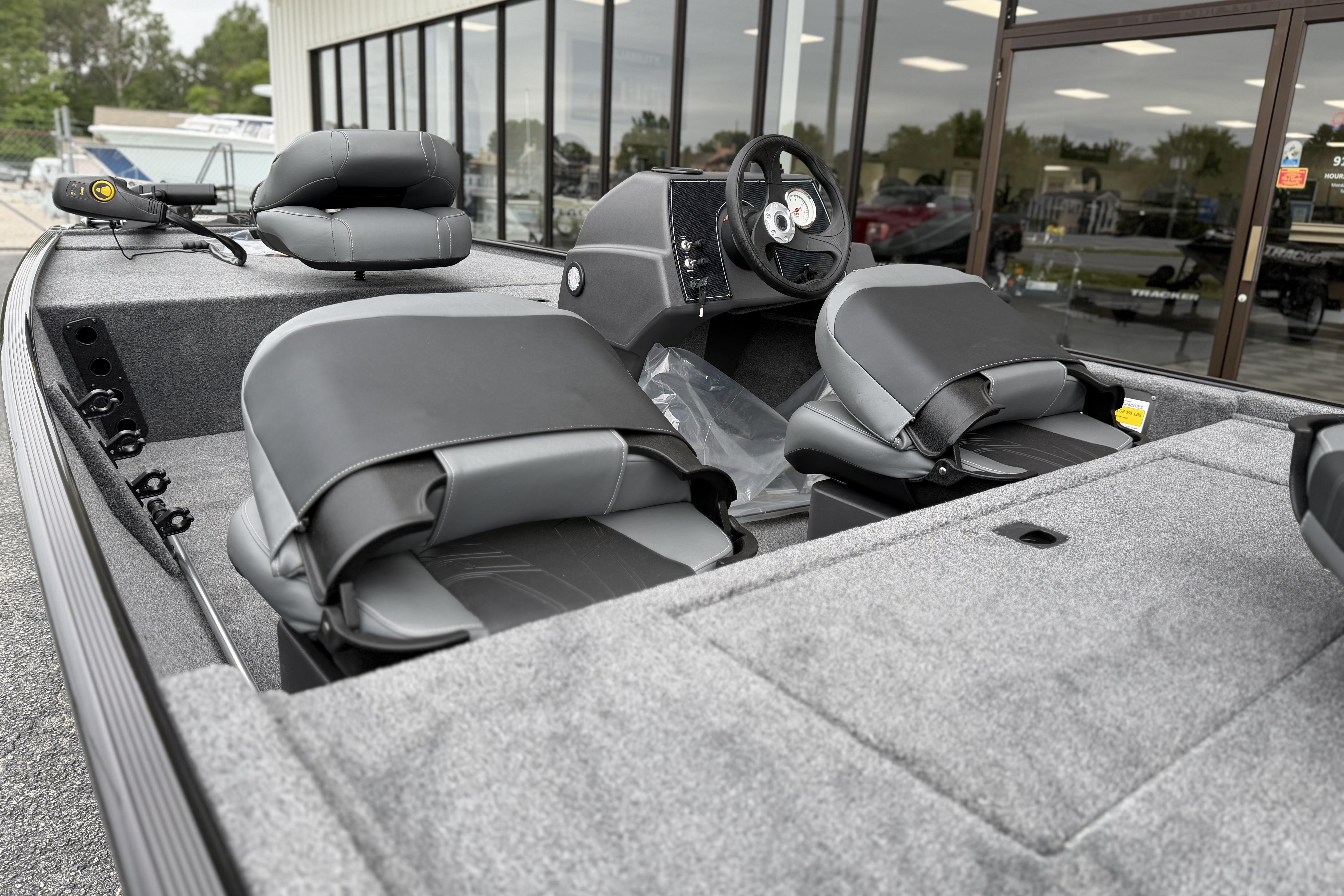 2026 Tracker Bass Tracker Classic XL boat interior with gray seating and steering console.