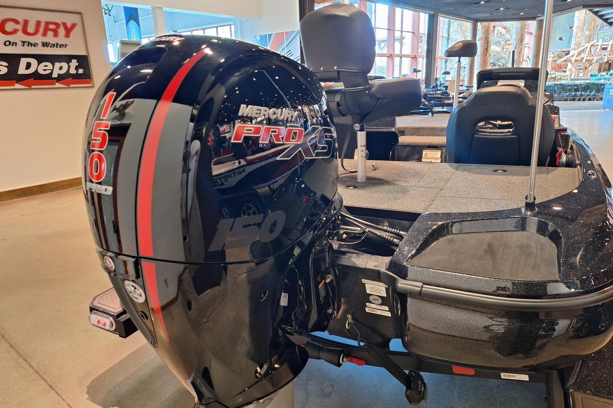 2026 Nitro Z18 boat with Mercury 150 Pro XS engine in showroom.