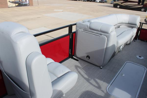 2025 Regency 230 DL3 pontoon boat interior with gray seating and red paneling.