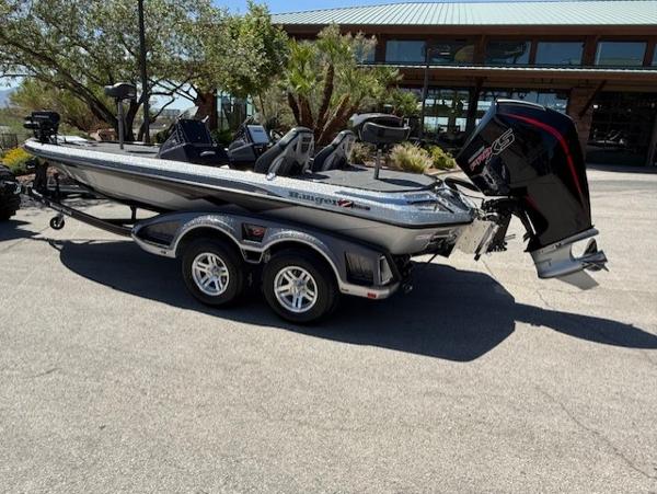 2025 Ranger Z519R Cup-Equipped boat on trailer, parked outdoors near a building.