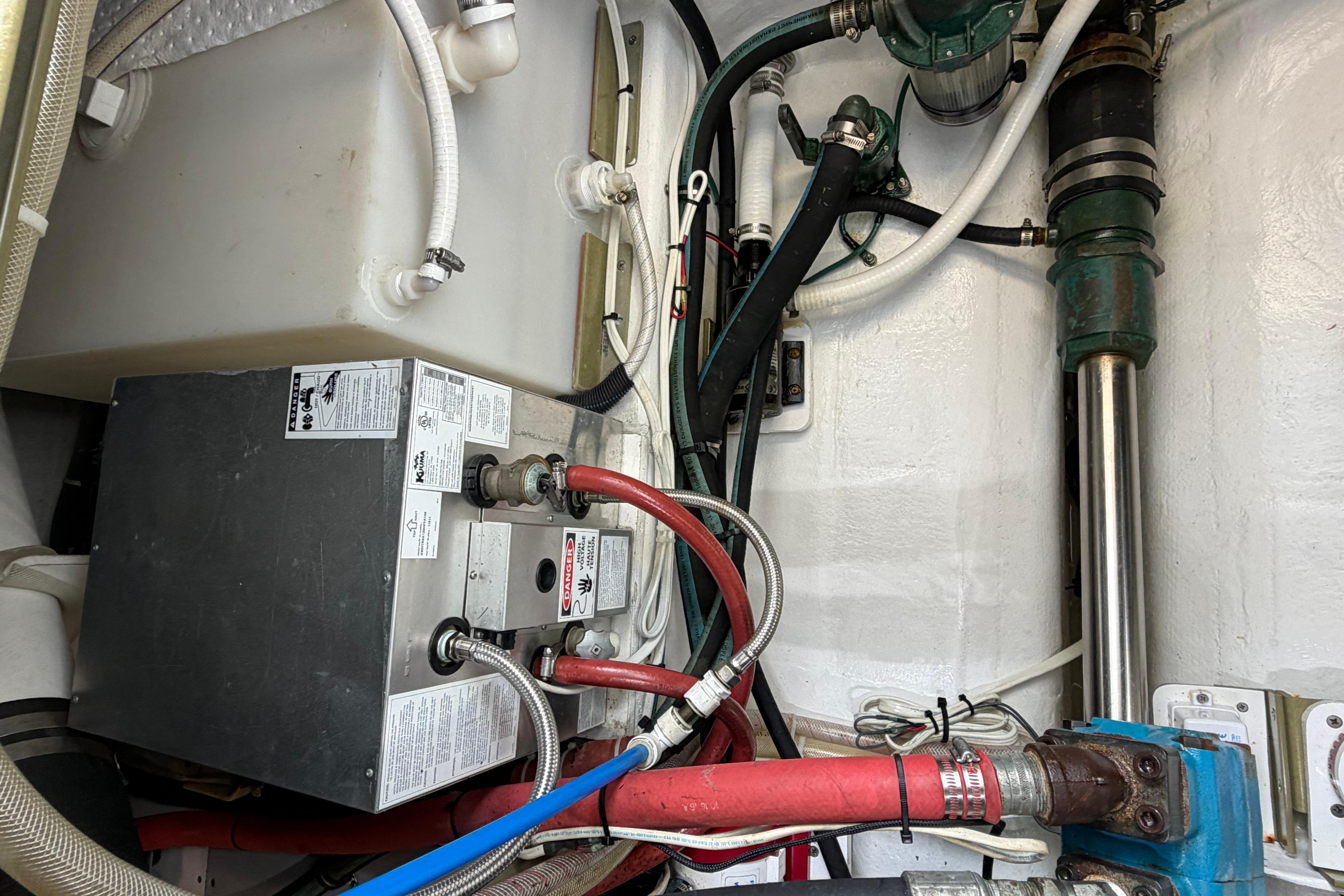 Engine room of 2018 H&H Marine Osmond Beal with various pipes and machinery.