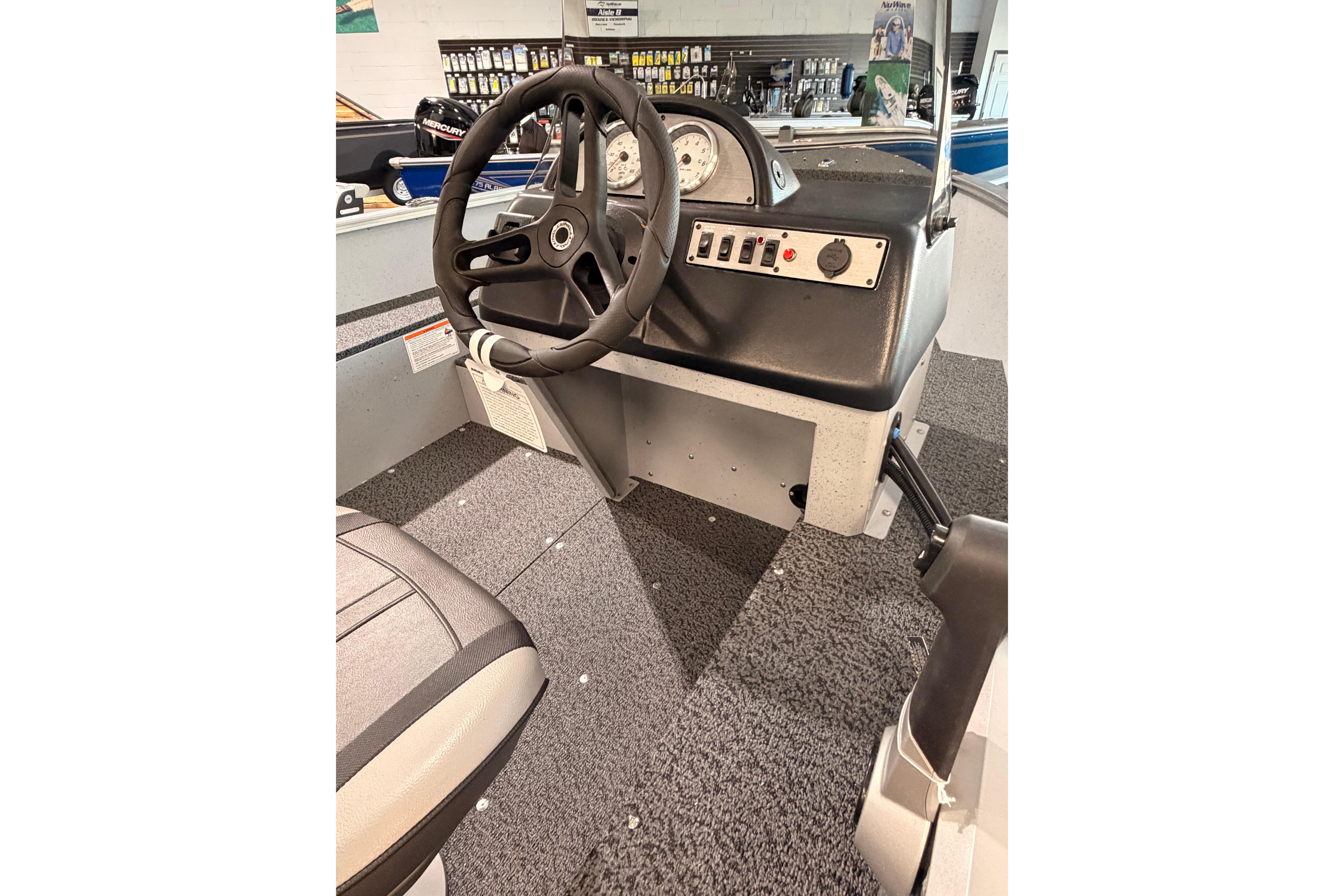 2027 Lund 1600 Fury SS boat interior with steering wheel and control panel.