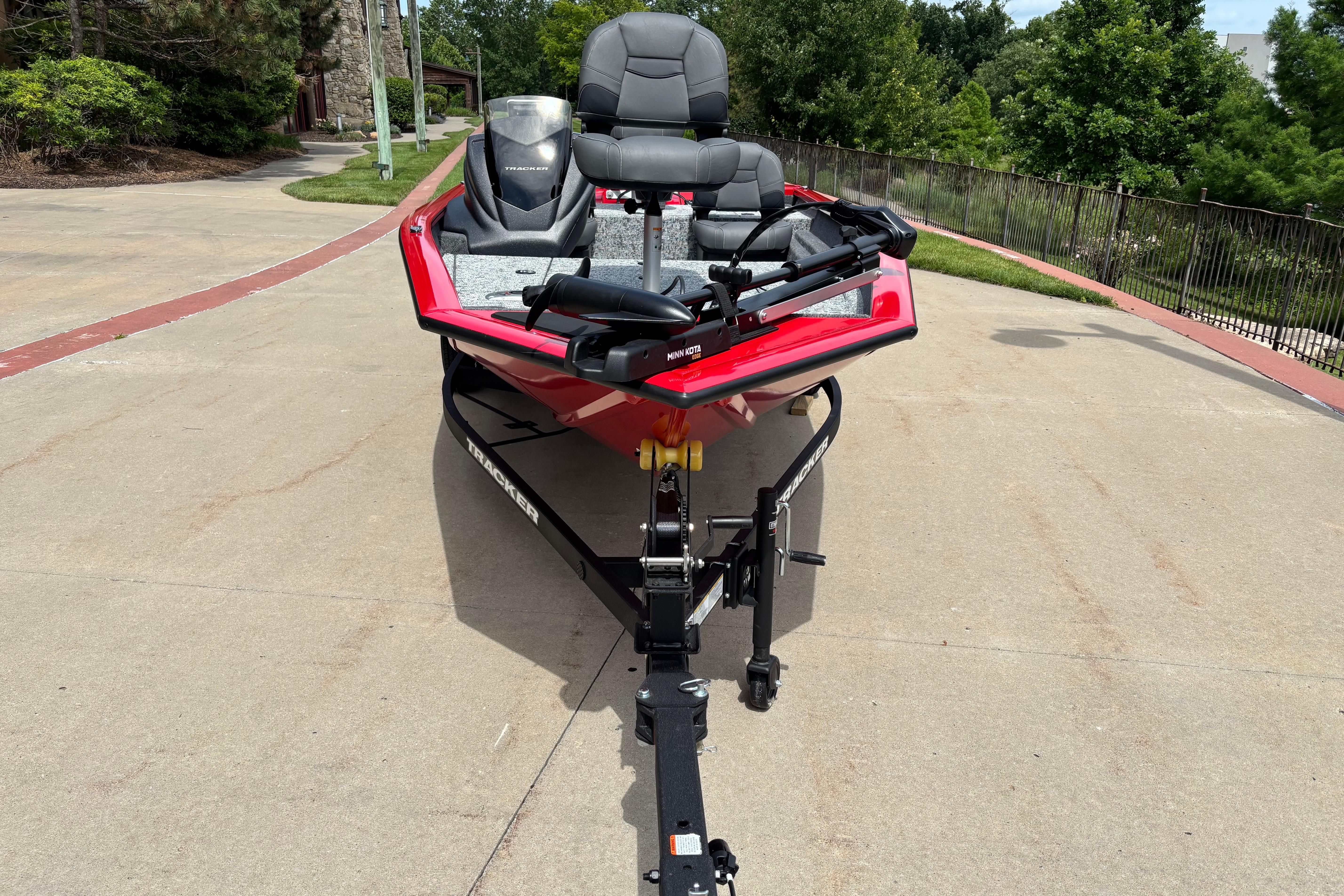 2026 Tracker Pro Team 175 Crappie Edition boat on trailer, parked outdoors.