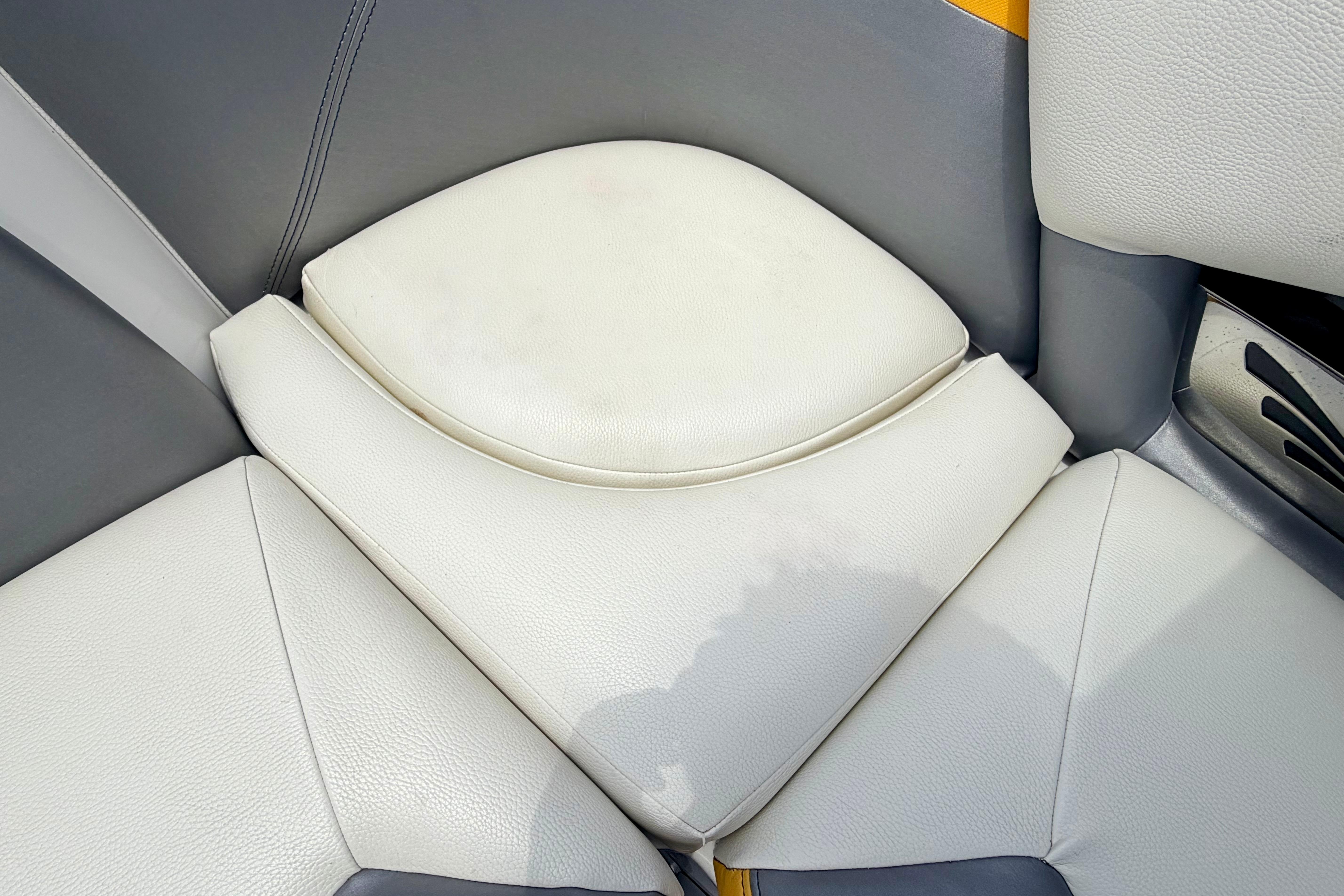 2014 Tigé R20 boat interior with white and gray cushioned seating.