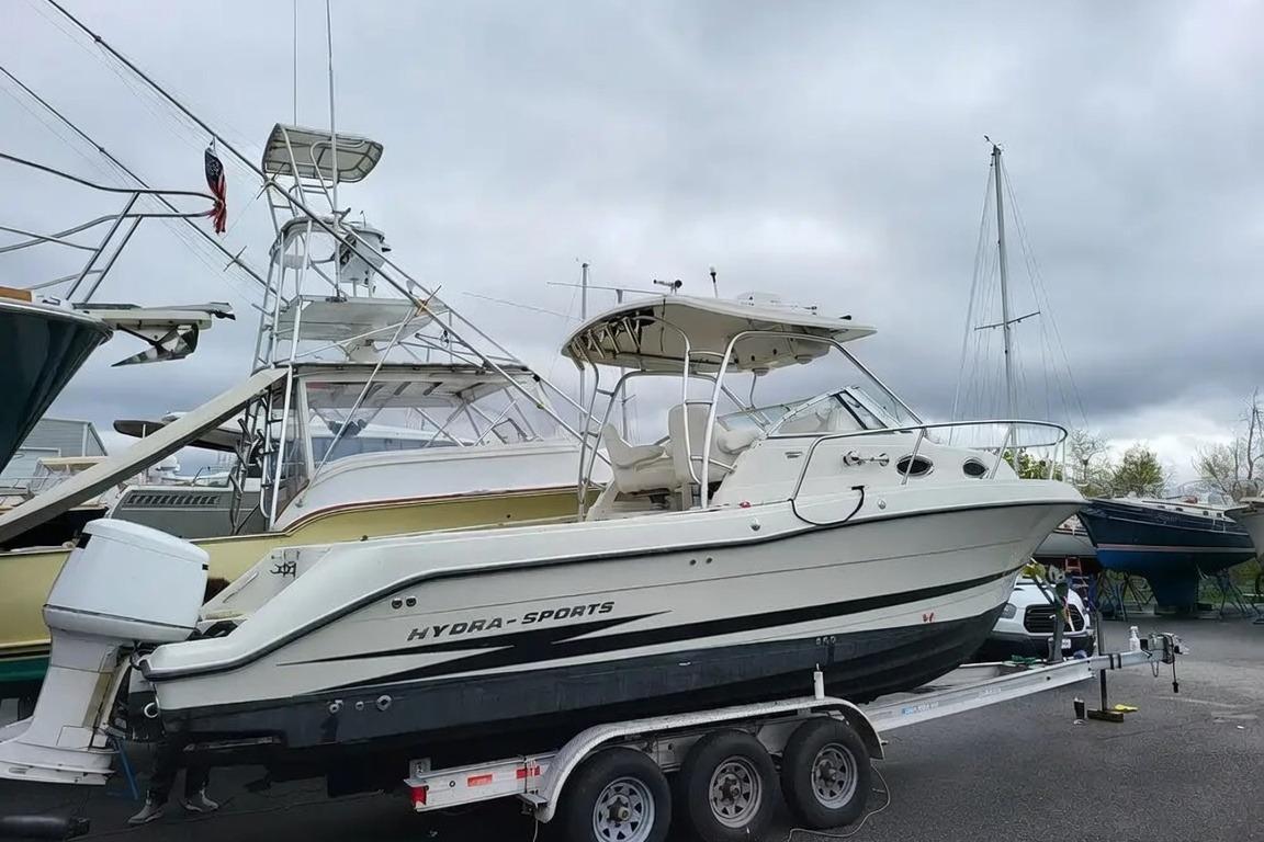 2003 Hydra-Sports Vector 2800 WA boat on trailer, overcast sky background.