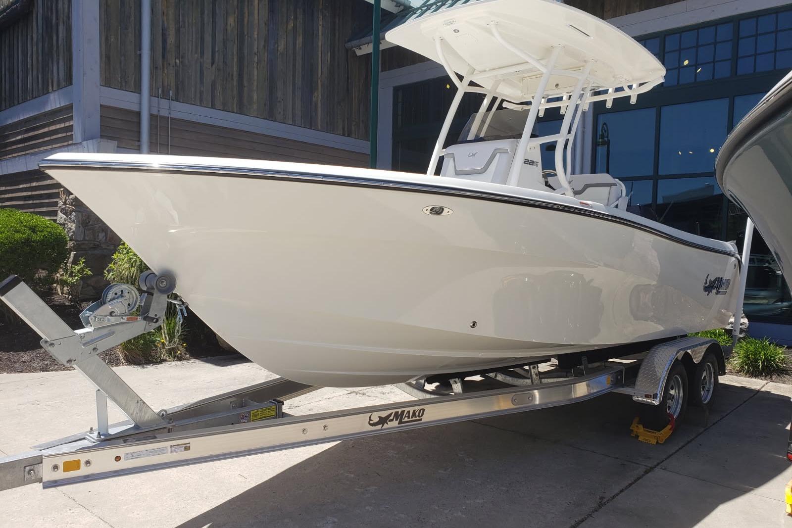 2026 Mako 226 Center Console boat on trailer, displayed outdoors.
